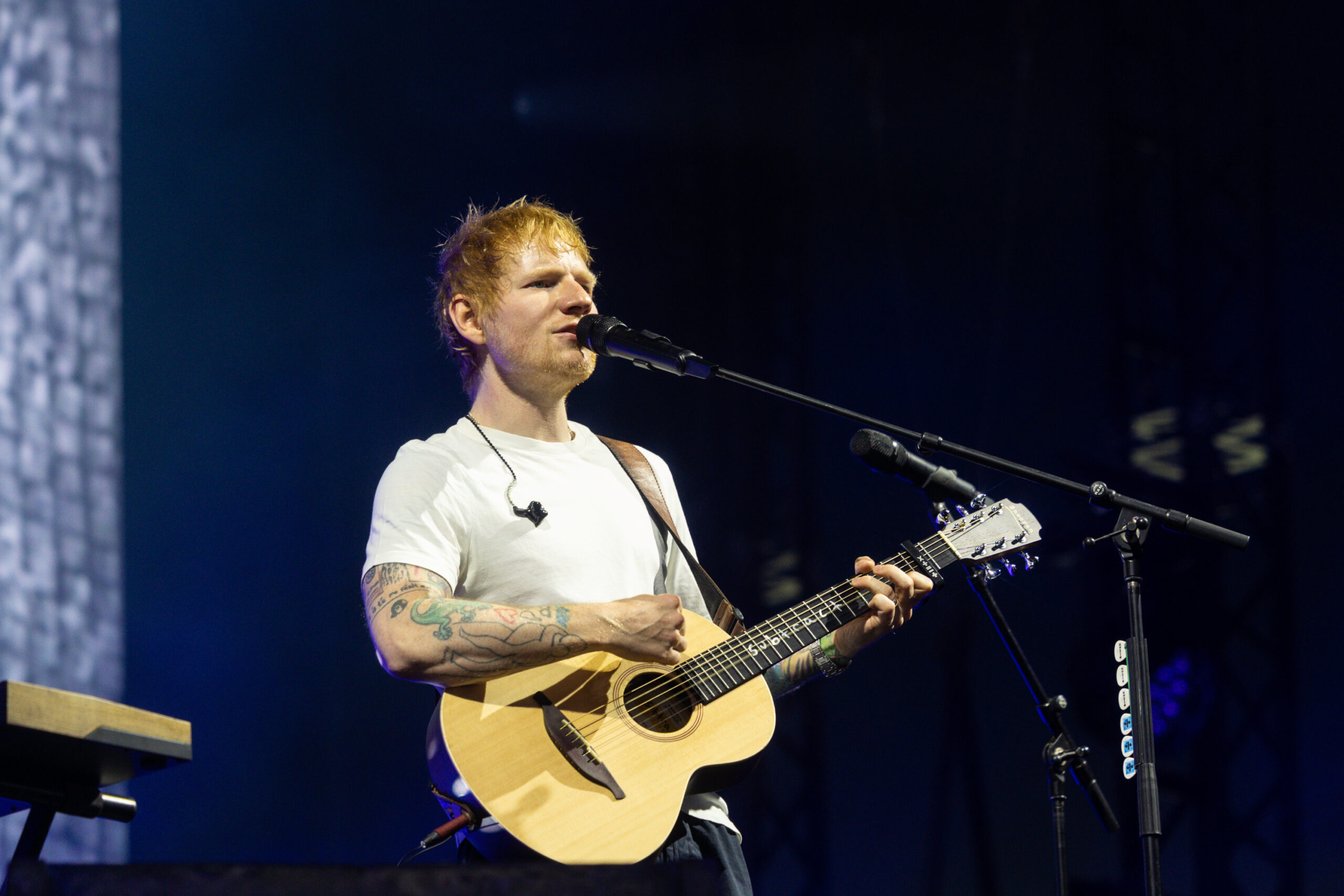 Ed sheeran on stage singing 
