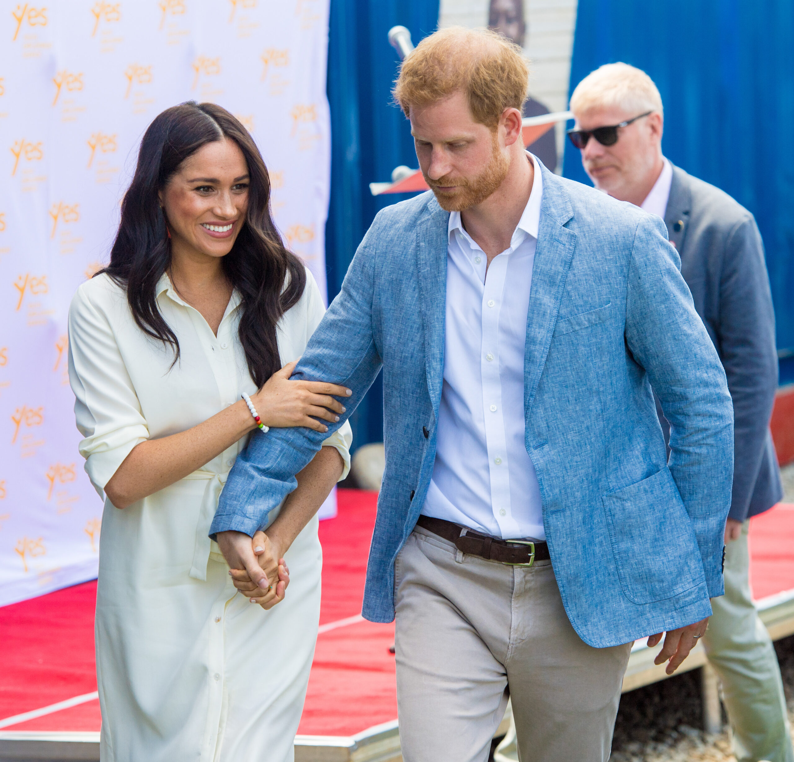 Meghan Markle and Prince Harry holding hands on engagement