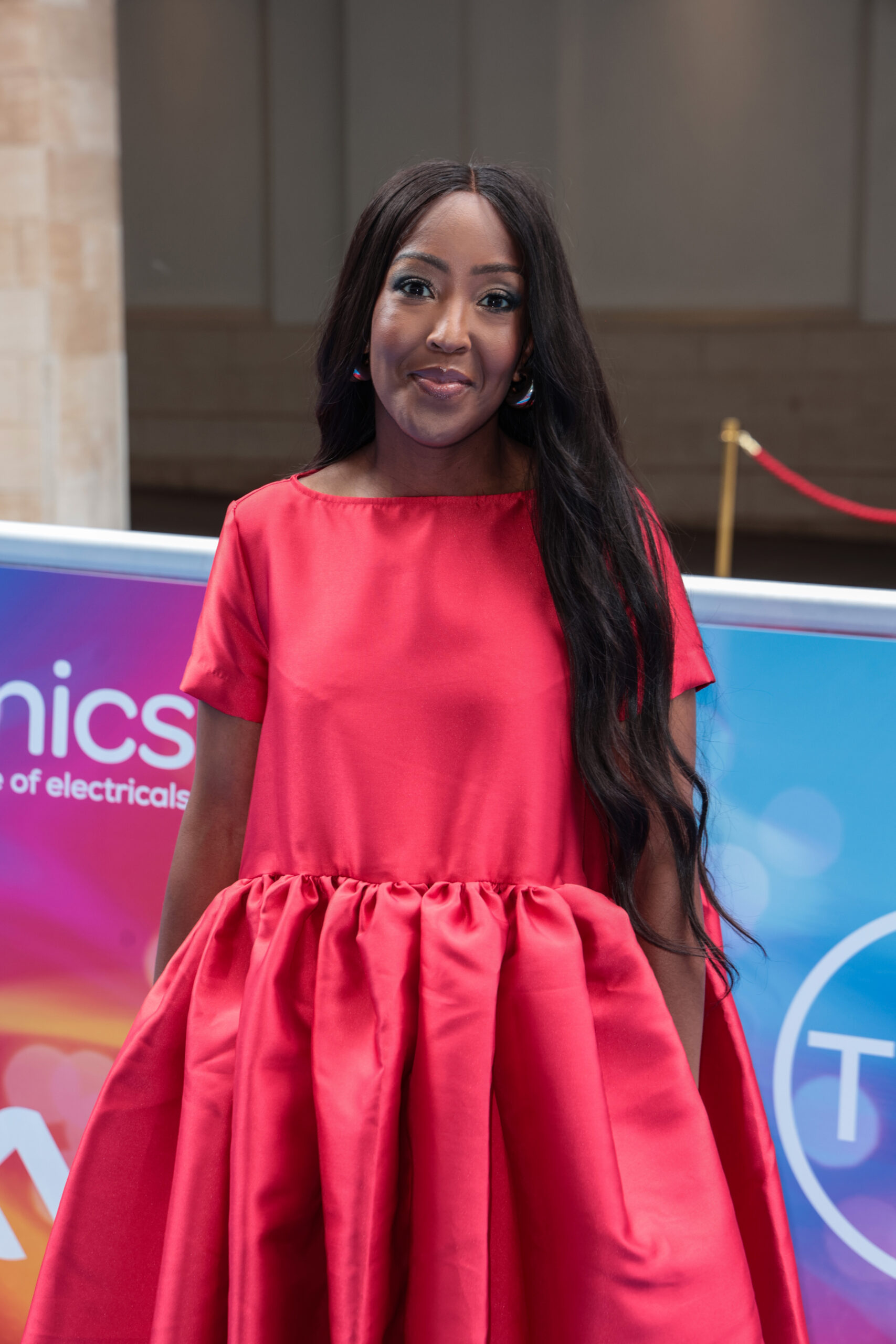 Angellica Bell wears red flowing dress