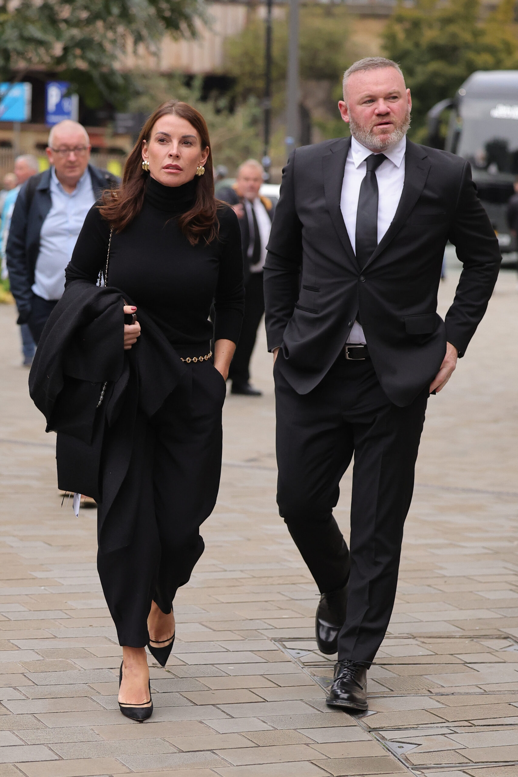 Coleen and Wayne Rooney walking together