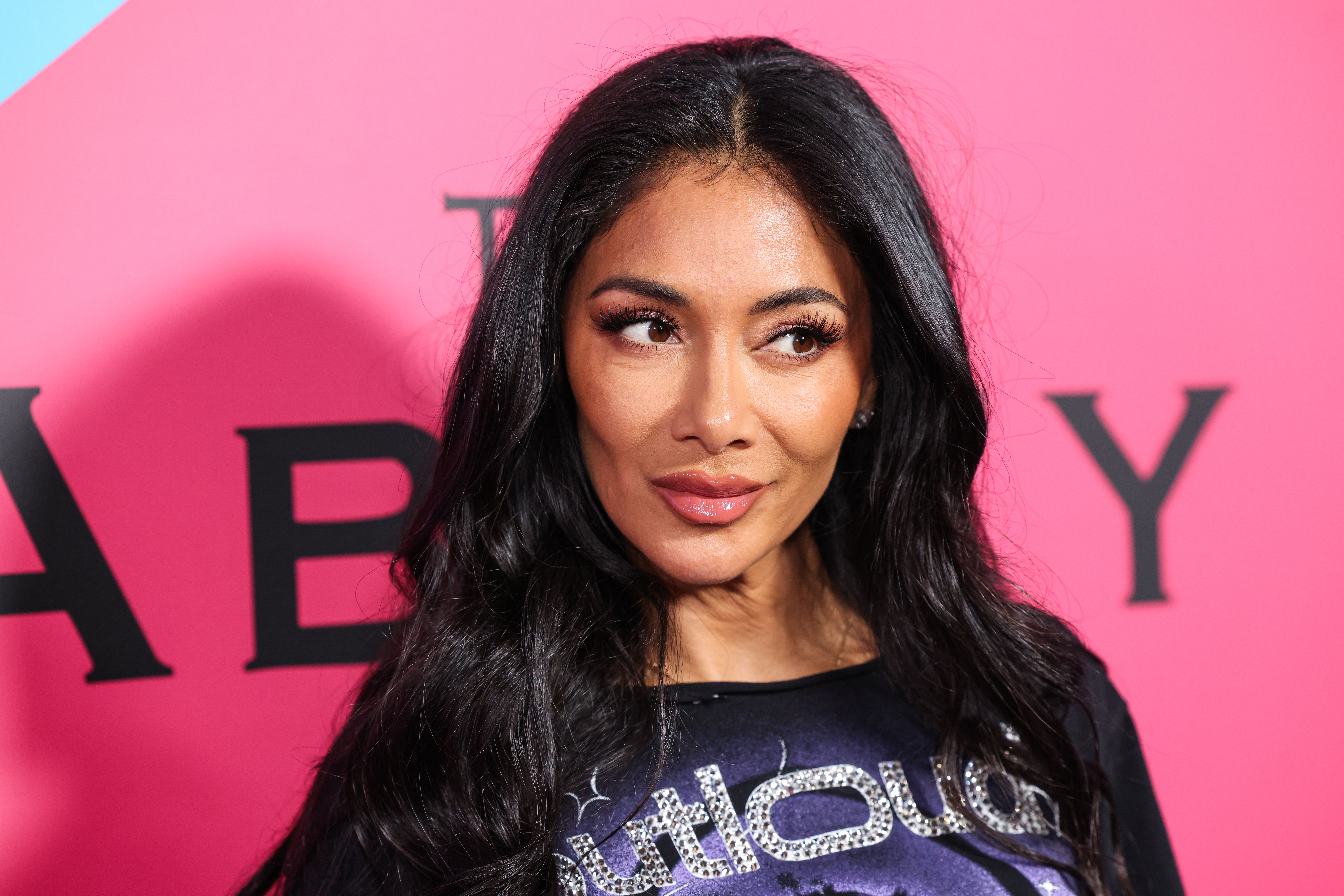 Nicole Scherzinger smirking 