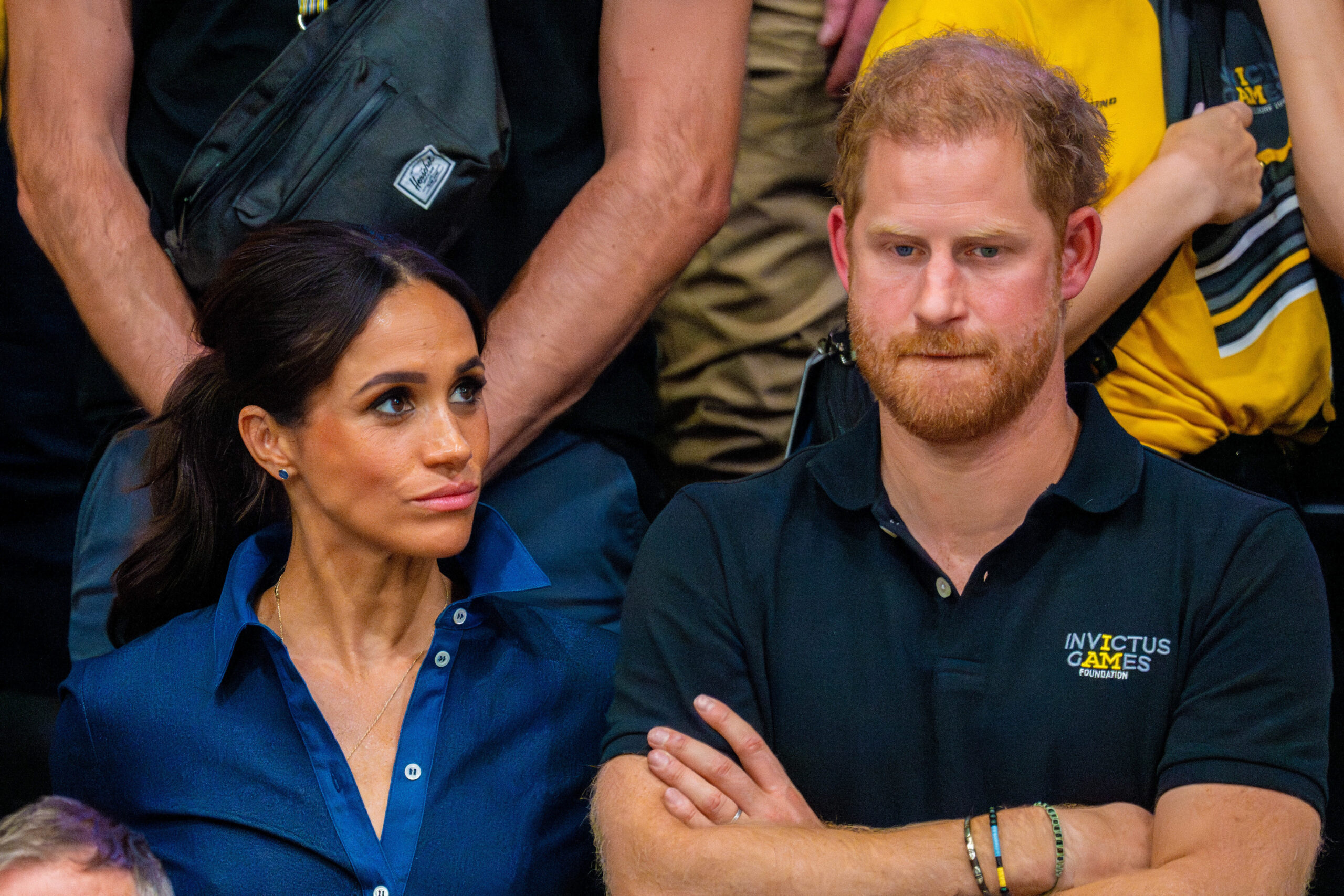 Meghan Markle and Prince Harry look bored while watching sport