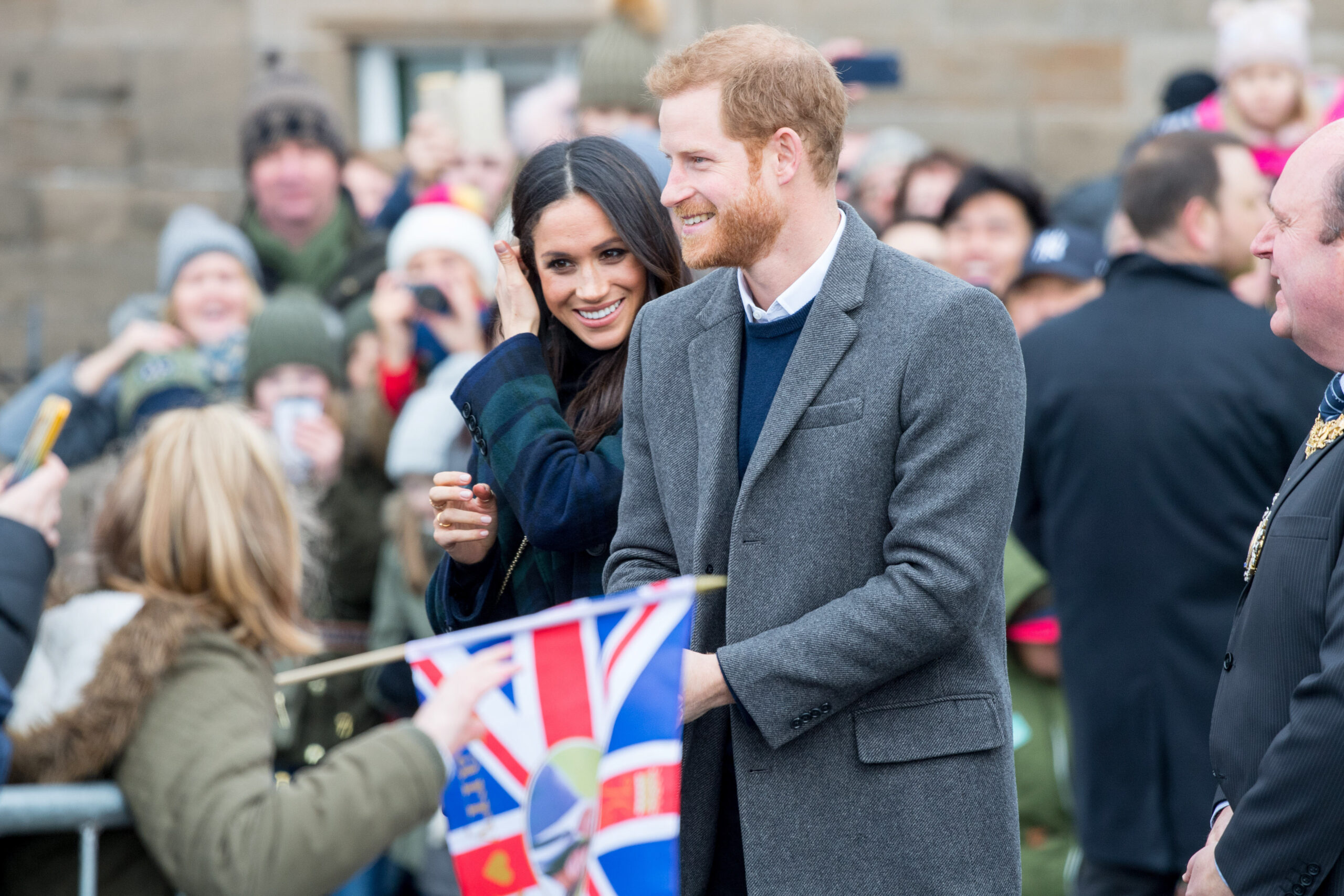 Prince Harry and Meghan greet people in the street
