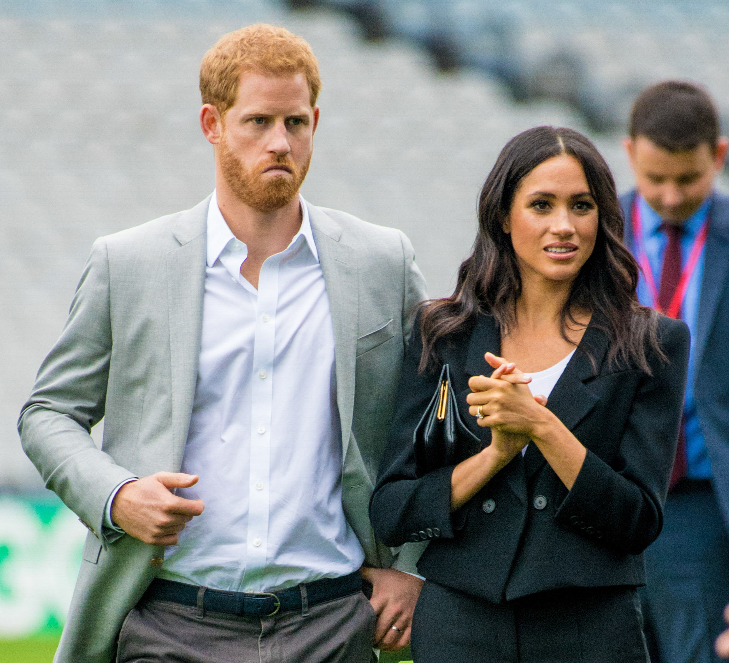 Prince Harry and Meghan looking concerned