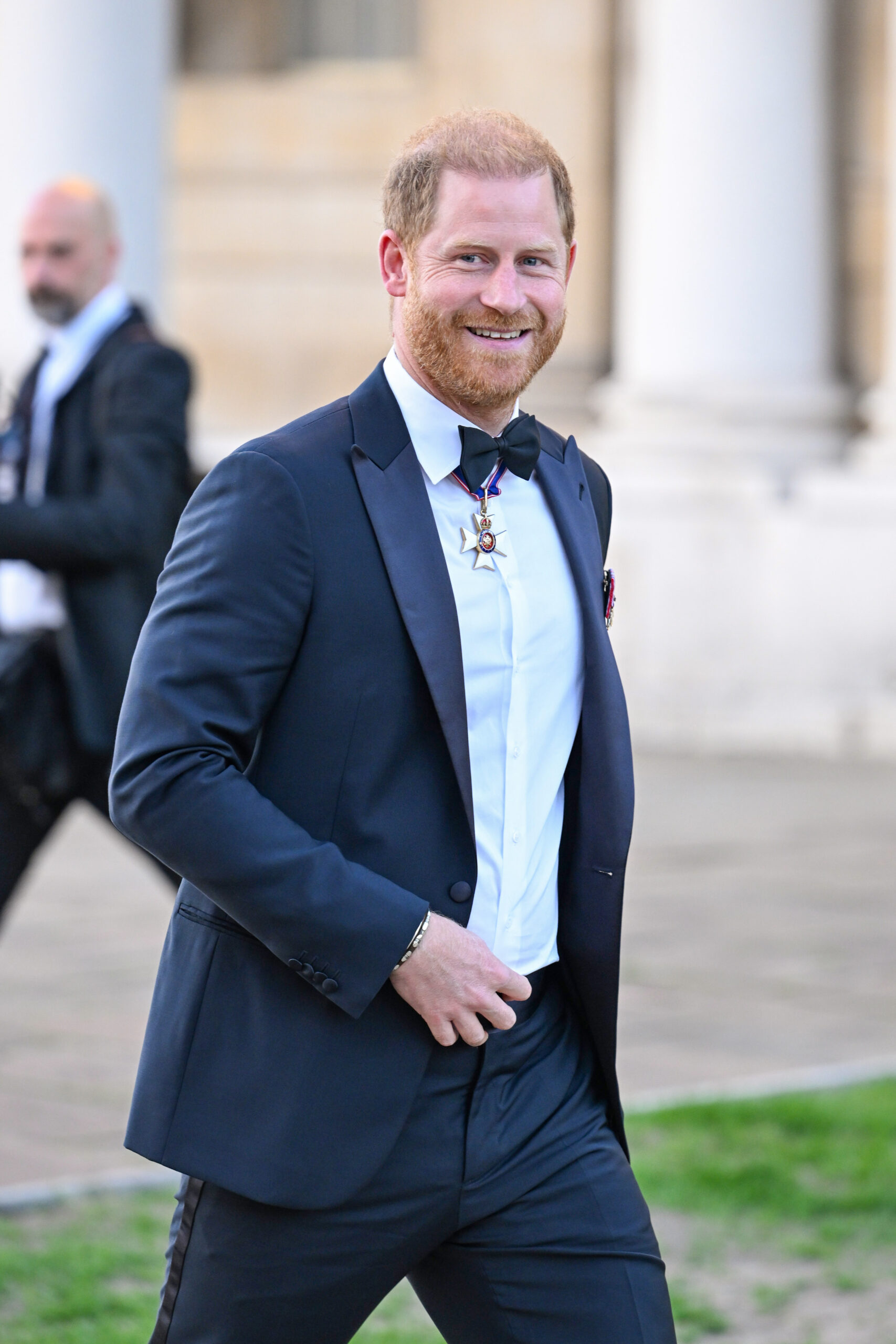 Prince Harry smiled as he welcomed friends and supporters at the Old Royal Naval College