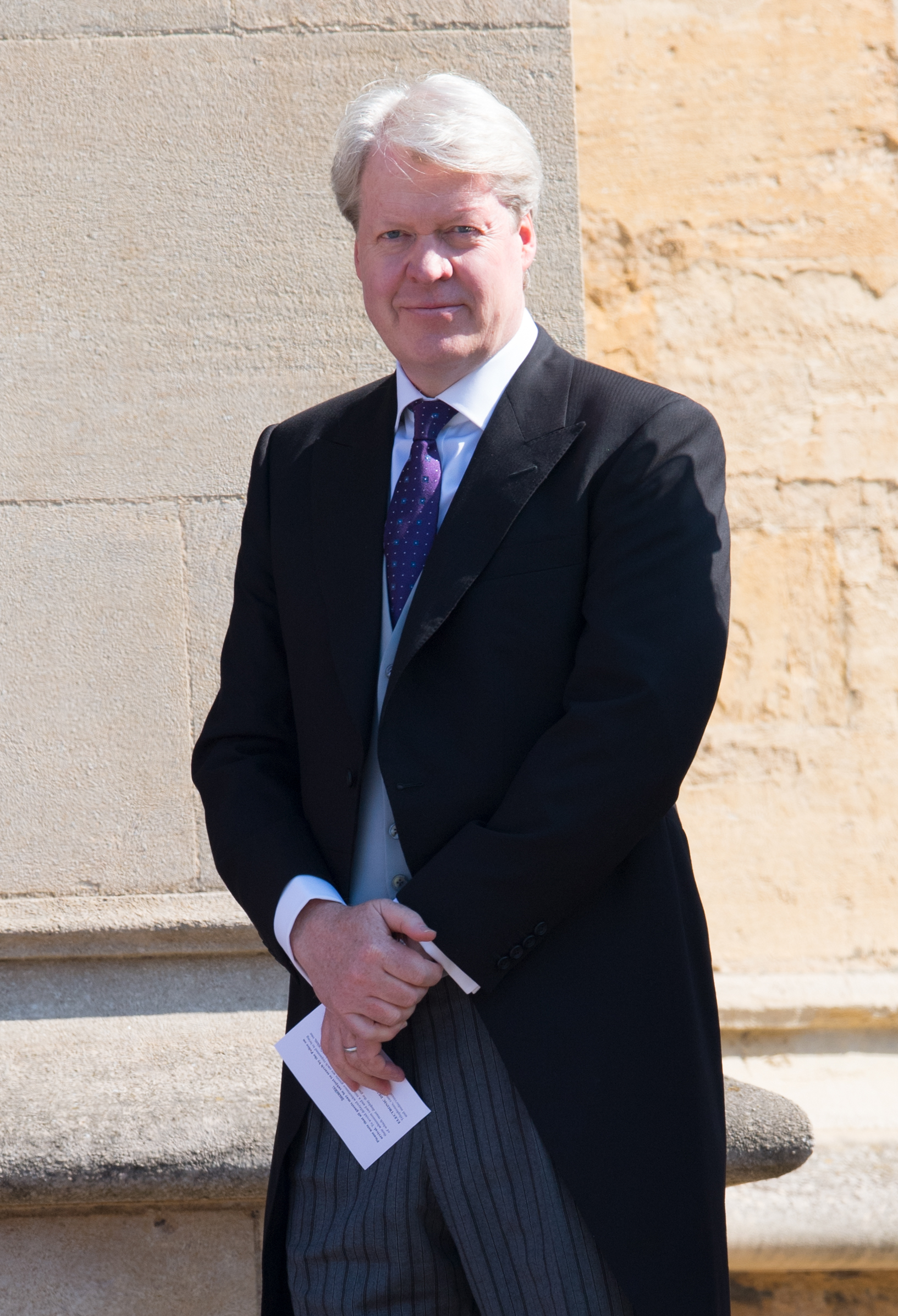 Earl Spencer wears a tie and suit jacket