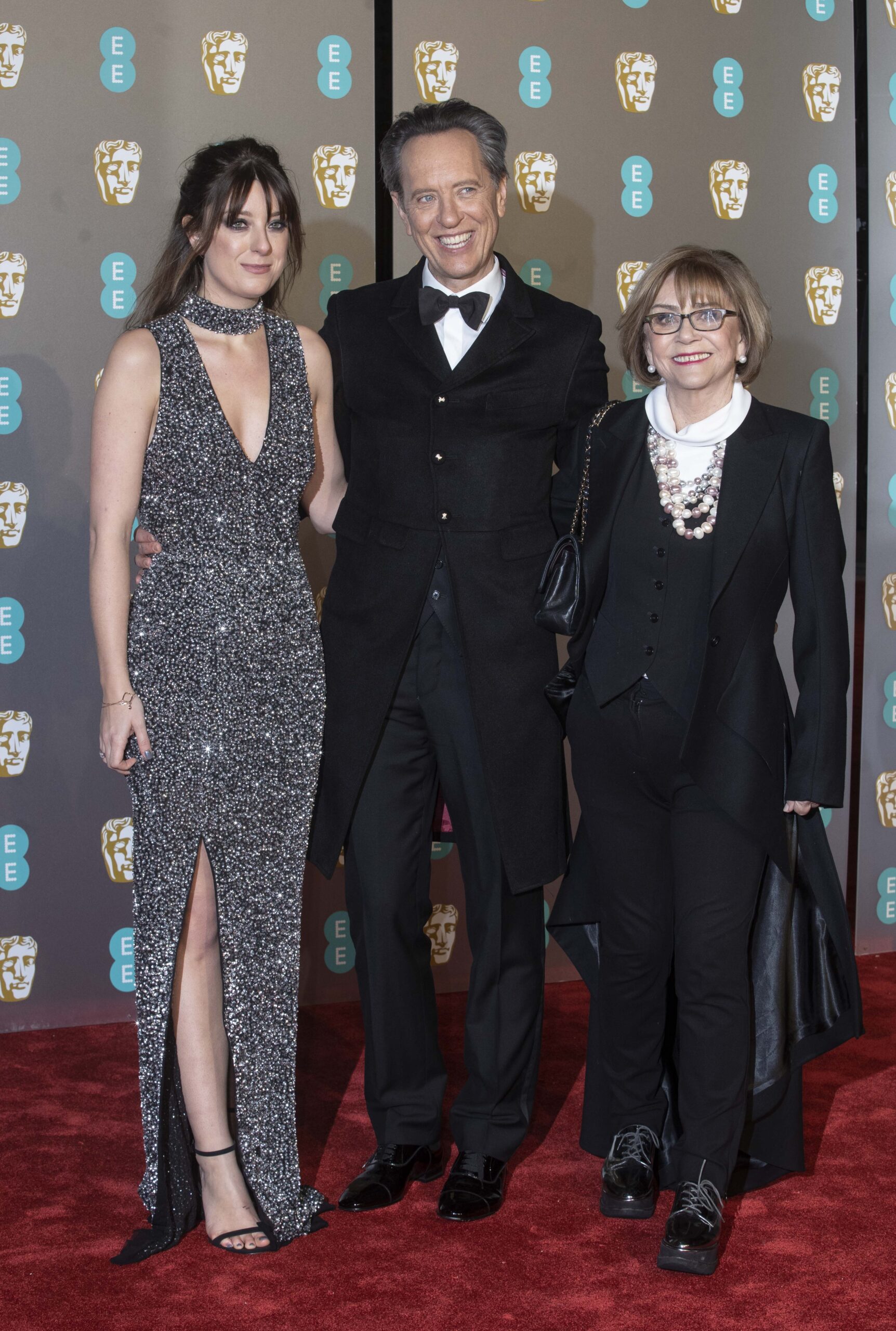 Richard E Grant with his wife and daughter at BAFTAs