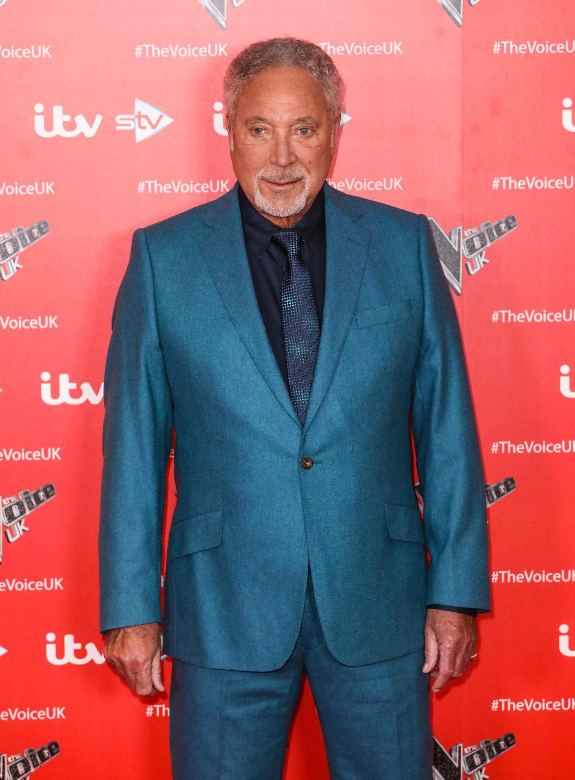 Sir Tom Jones at event in blue suit