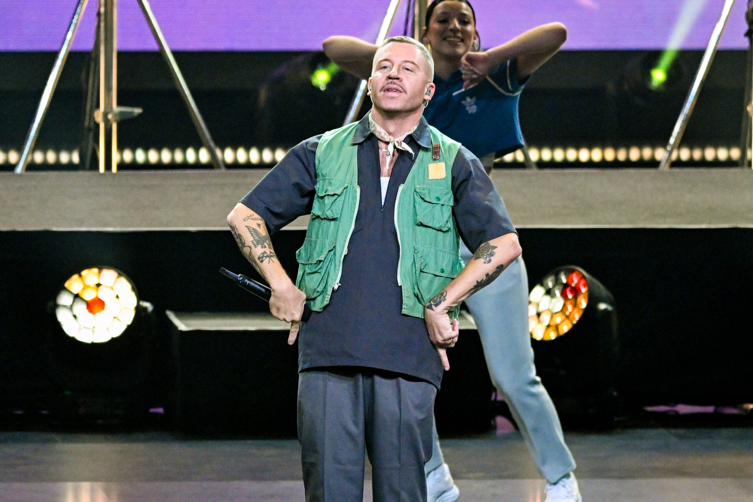 Macklemore performs on stage