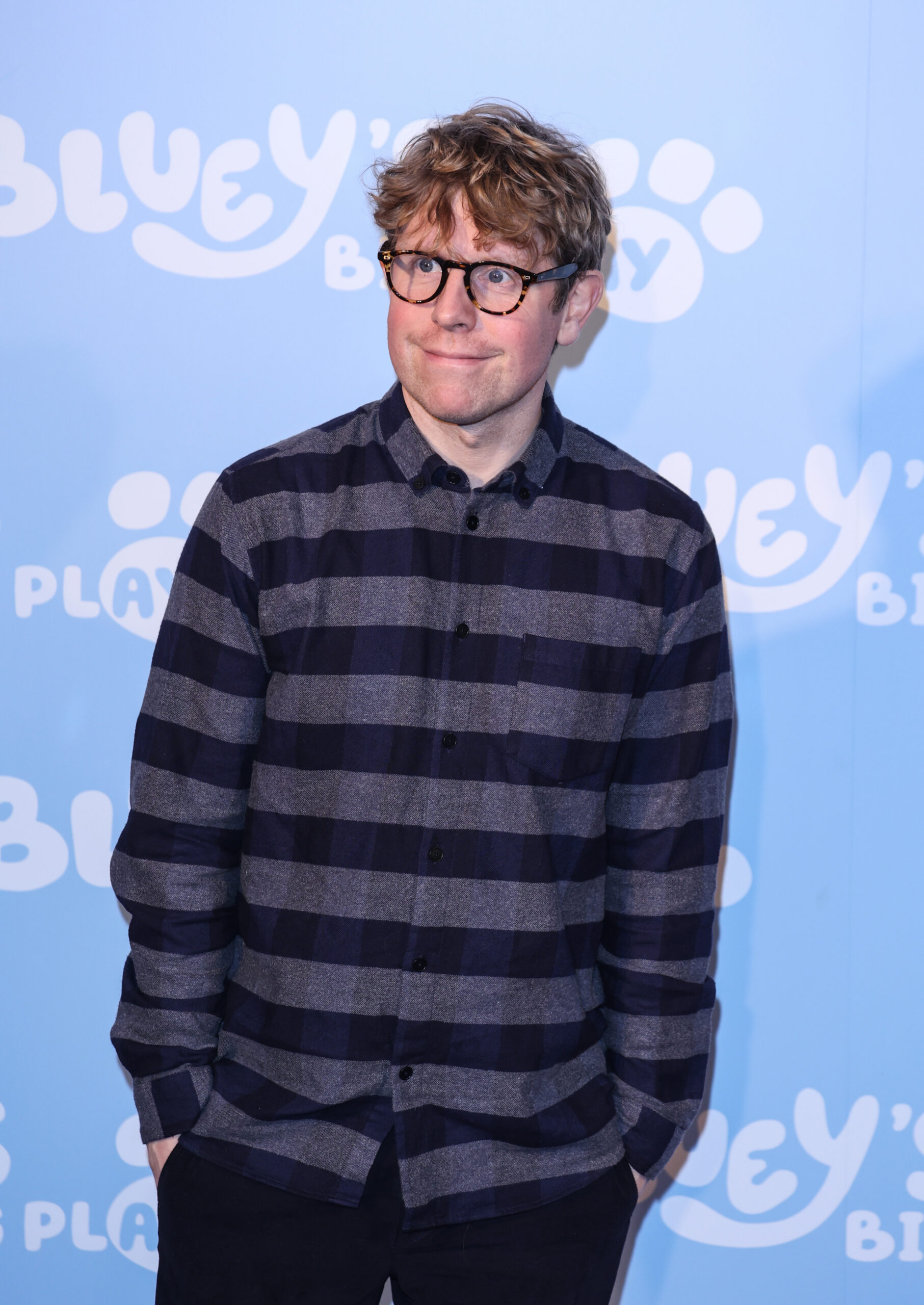 Josh Widdicombe in striped shirt at event