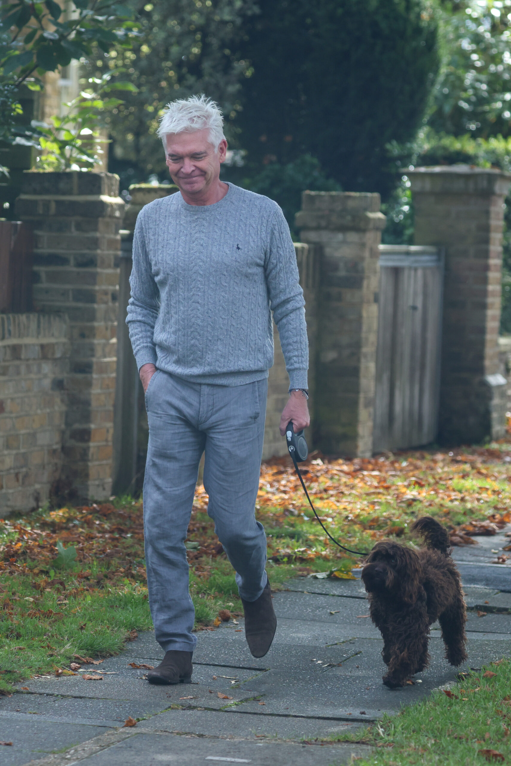 Phillip Schofield walking his dog 