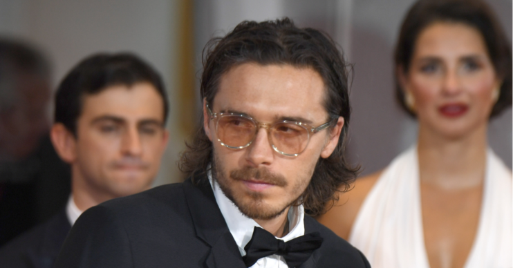 Brooklyn Beckham wears a tux and bow tie