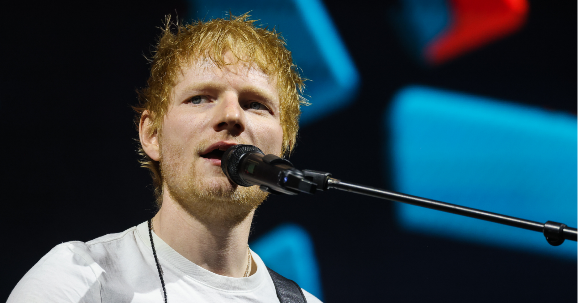 Ed Sheeran sings on stage