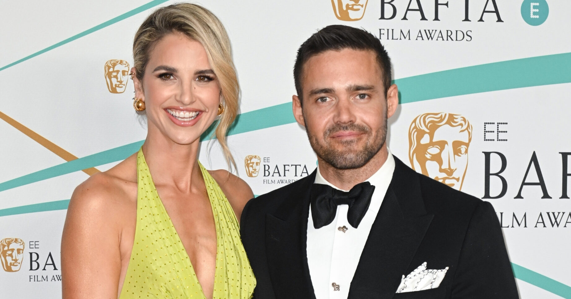 Vogue Williams and Spencer Matthews smiling at the BAFTAs