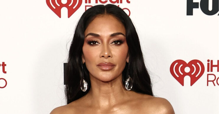 Nicole Scherzinger posing at event