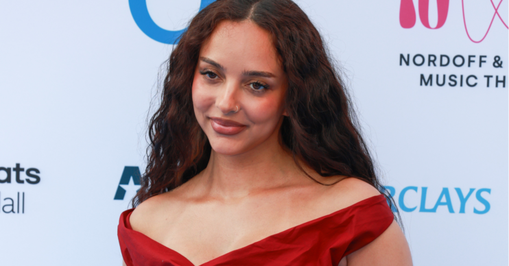 Jade Thirlwall wears a burgundy dress