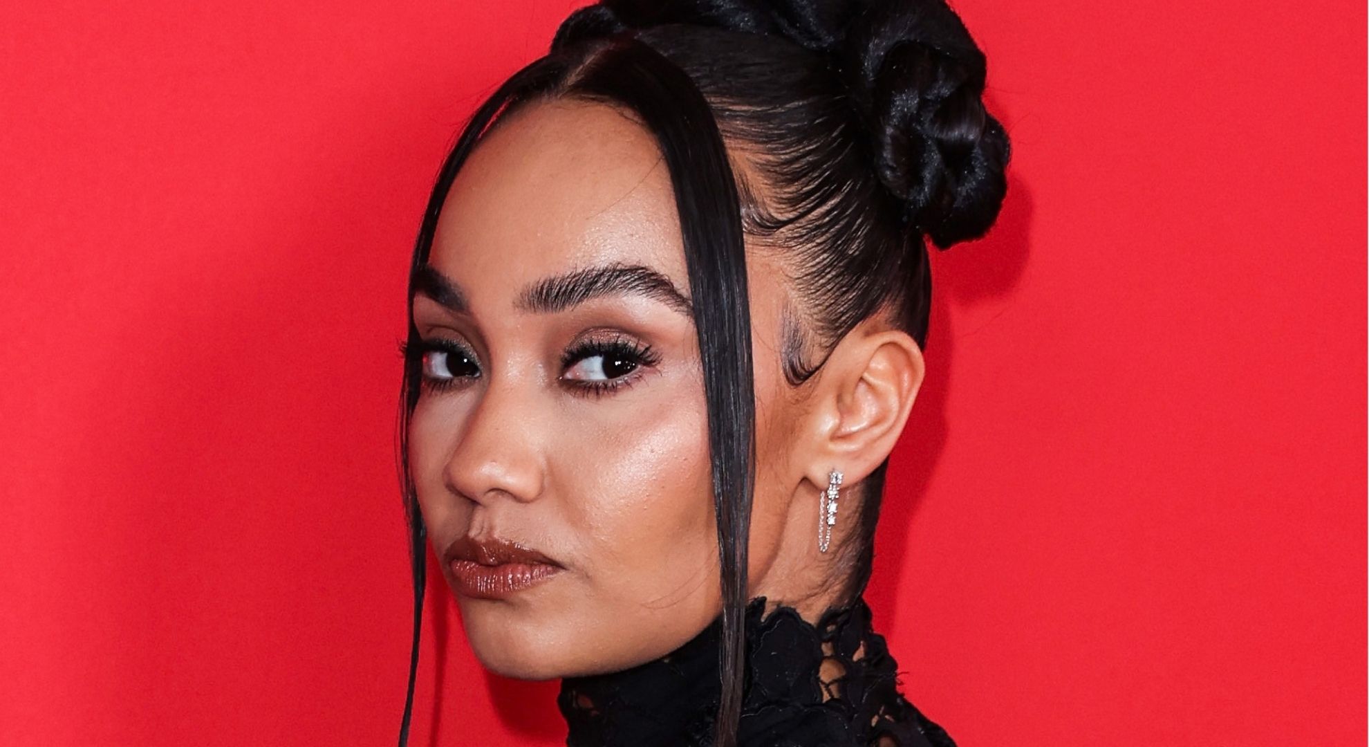 Heavily pregnant Leigh-Anne Pinnock’s body becomes a fountain as she squirts water during London Fashion Week show