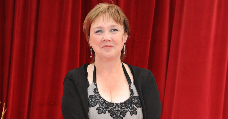 Pauline Quirke wears a dress and cardigan