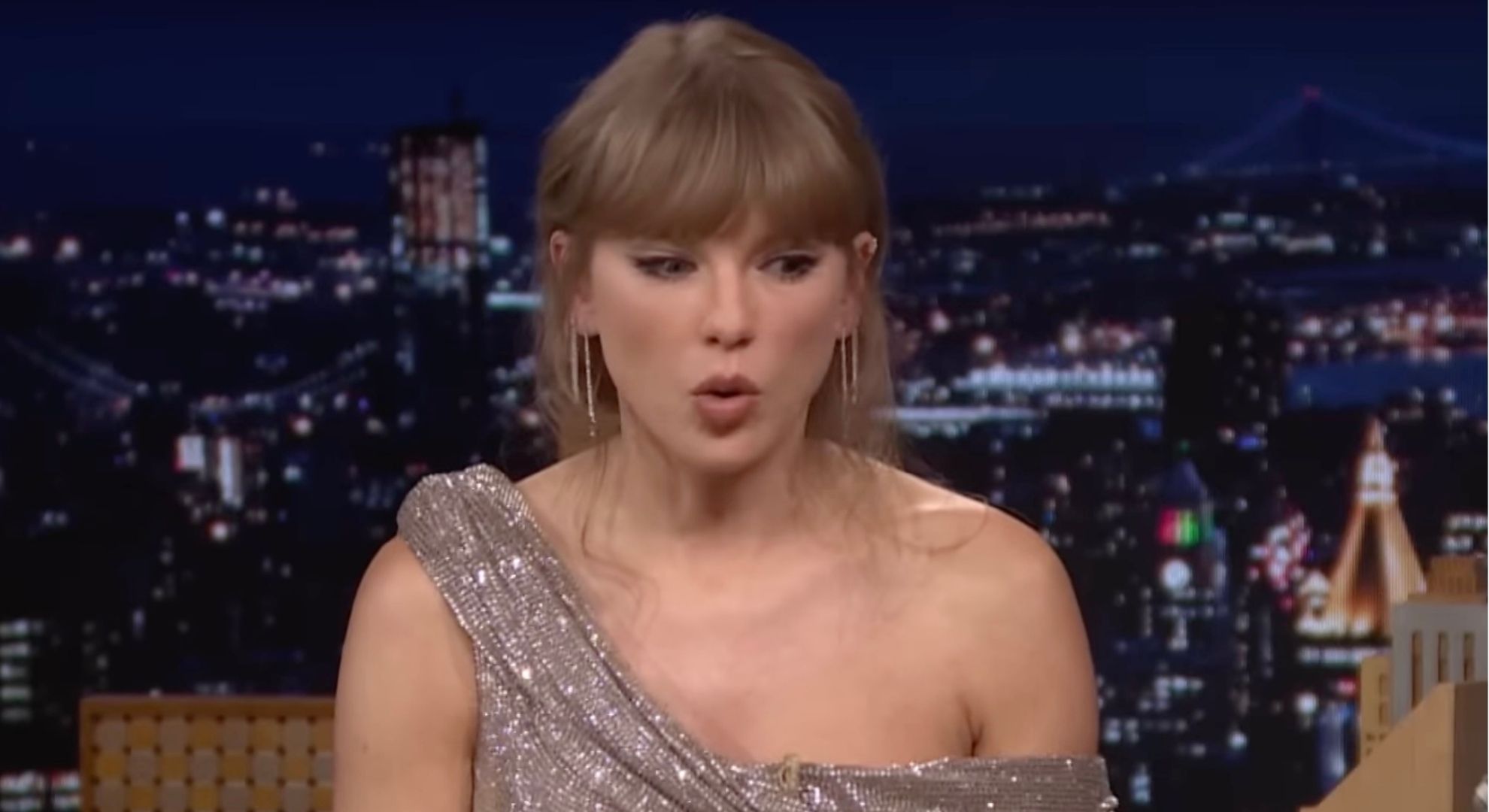 Taylor Swift looking down