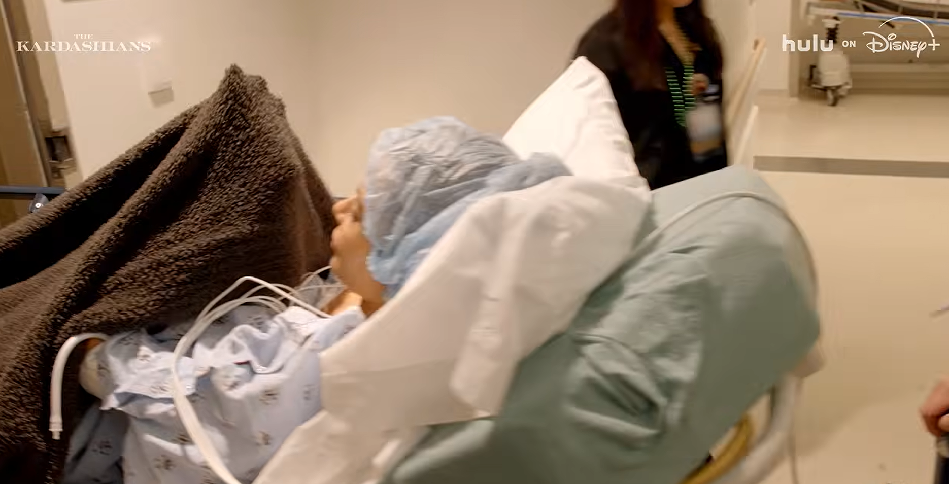 Kim Kardashian is wheeled around in a hospital bed