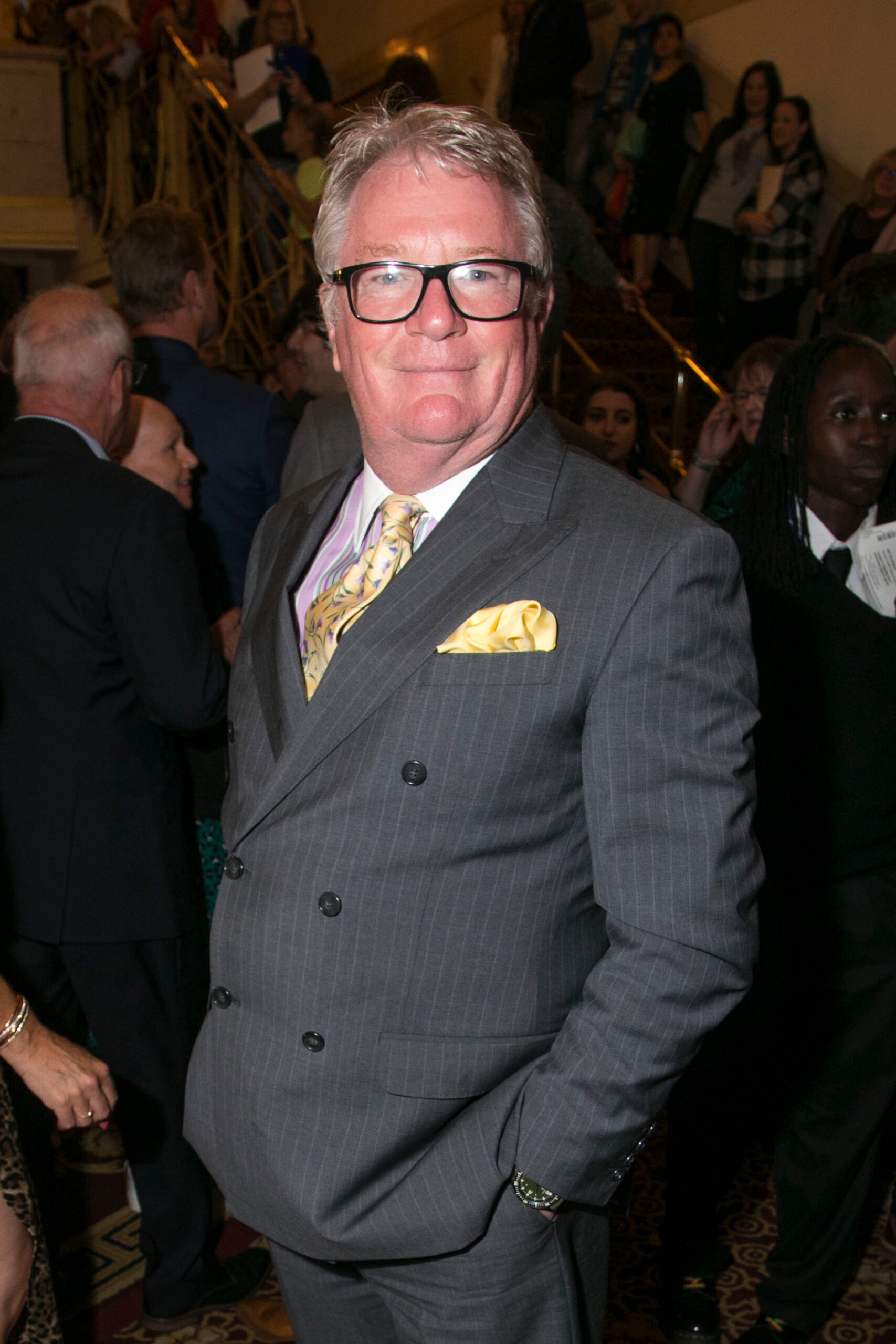 Jim Davidson smiling in suit