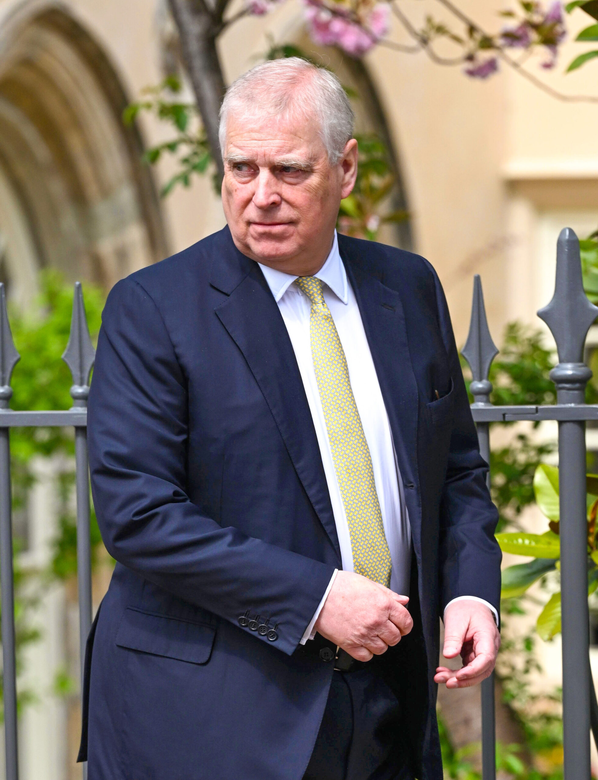 Prince Andrew wears a blue suit jacket