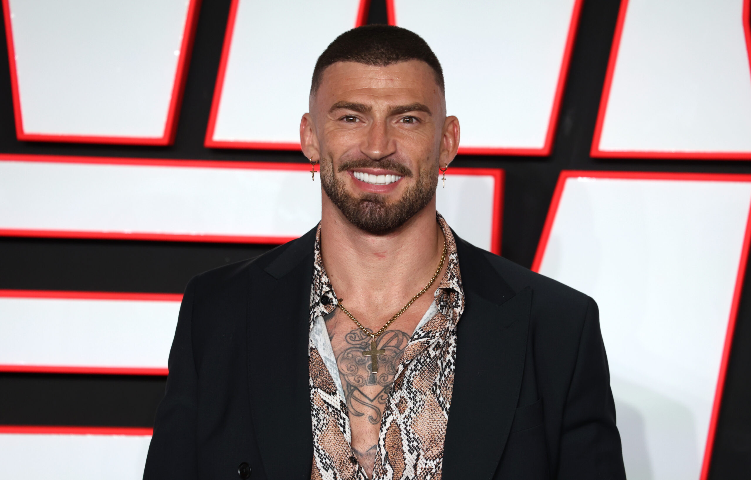 Jake Quickenden smiling Running Man UK Premiere