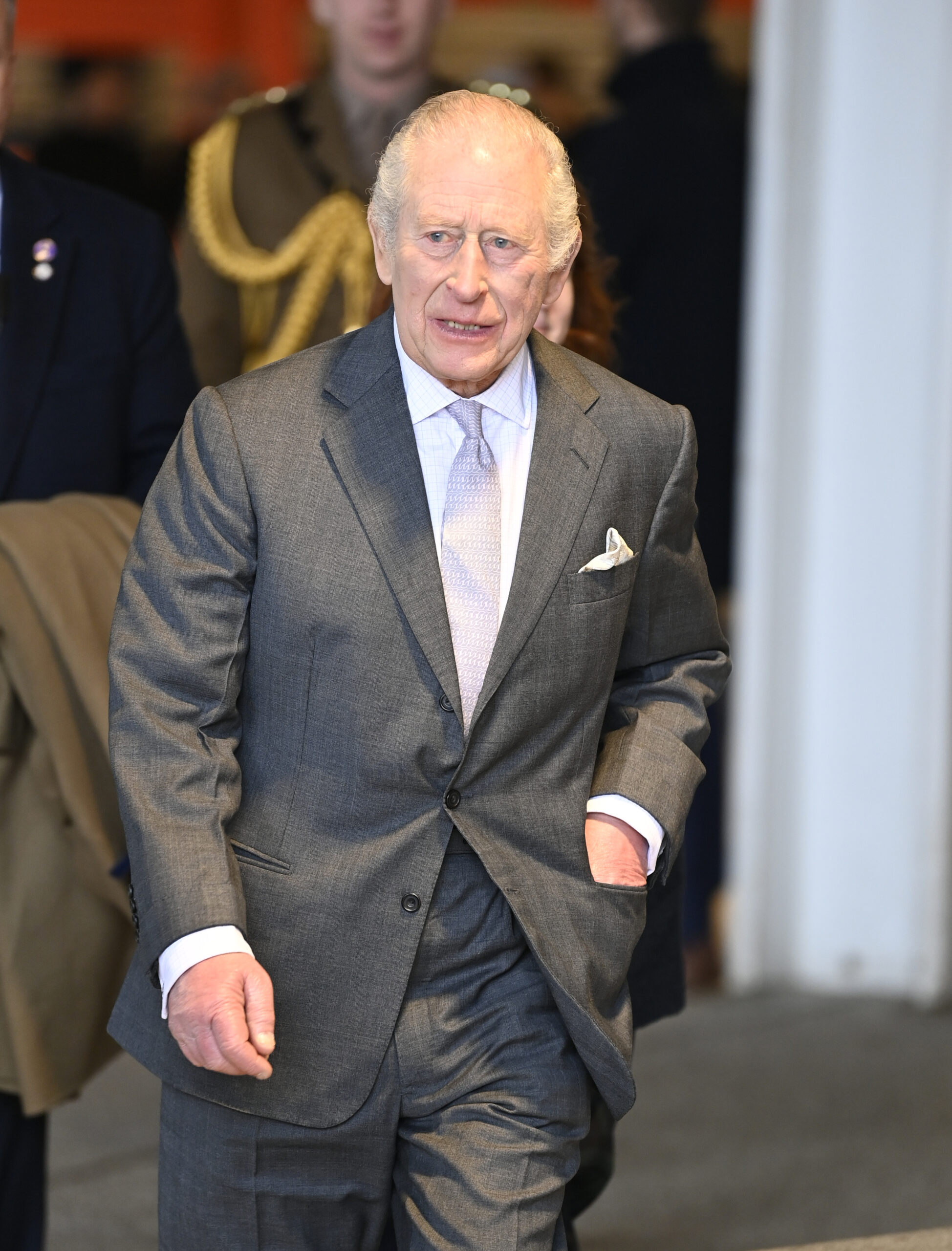 King Charles in grey suit