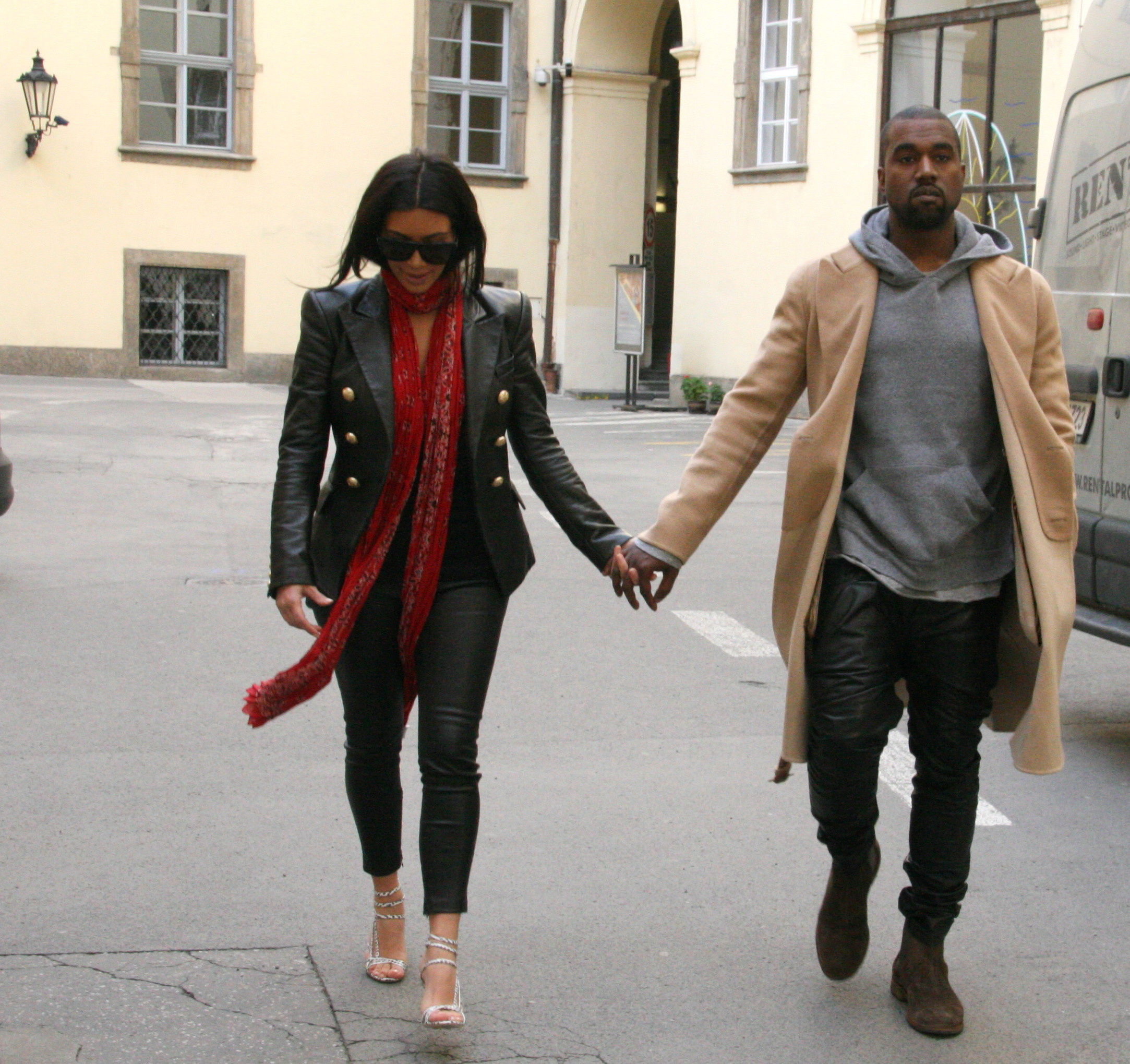 Kanye West and Kim Kardashian walk hand-in-hand
