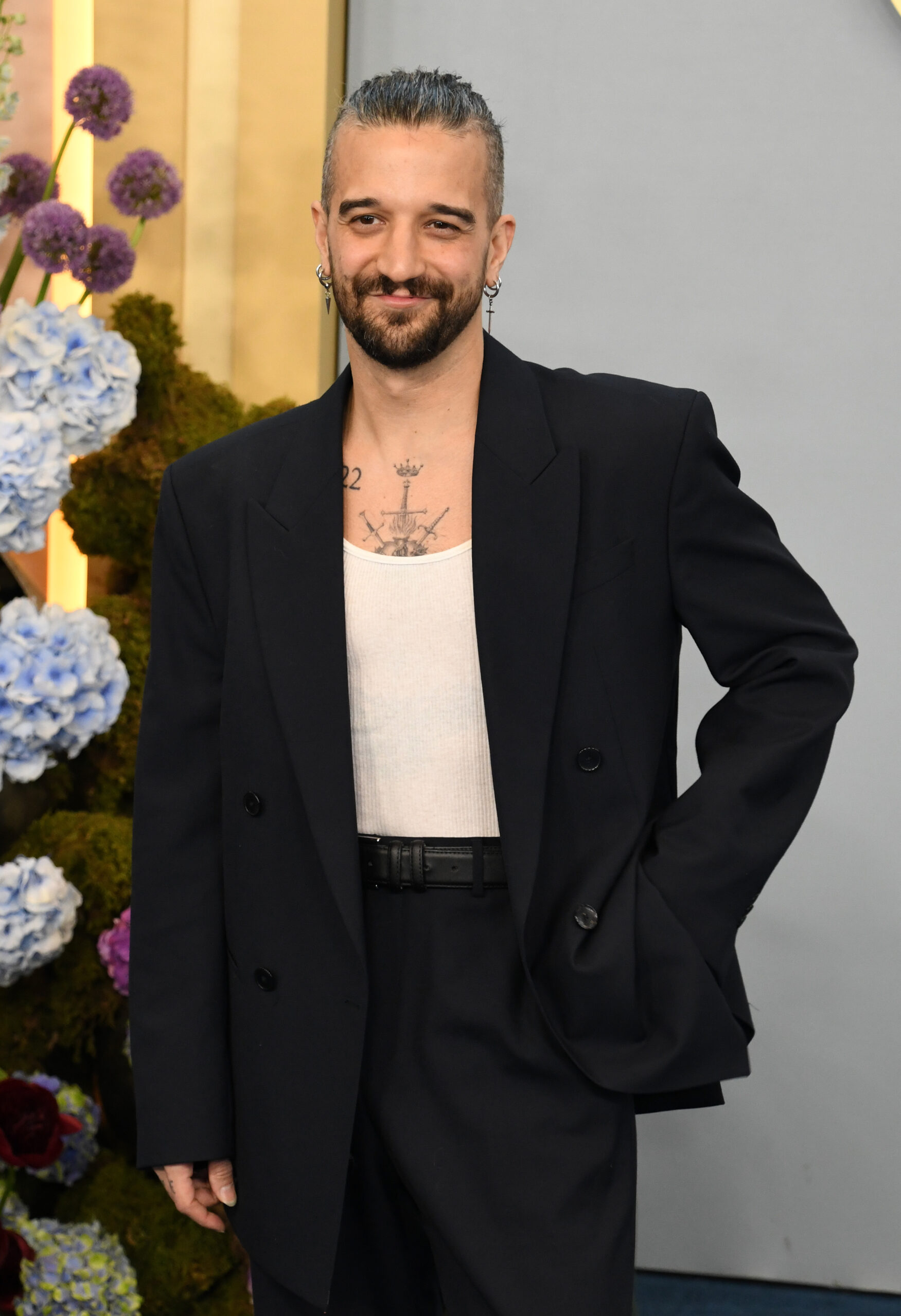 Mark Ballas in a black suit and white t-shirt