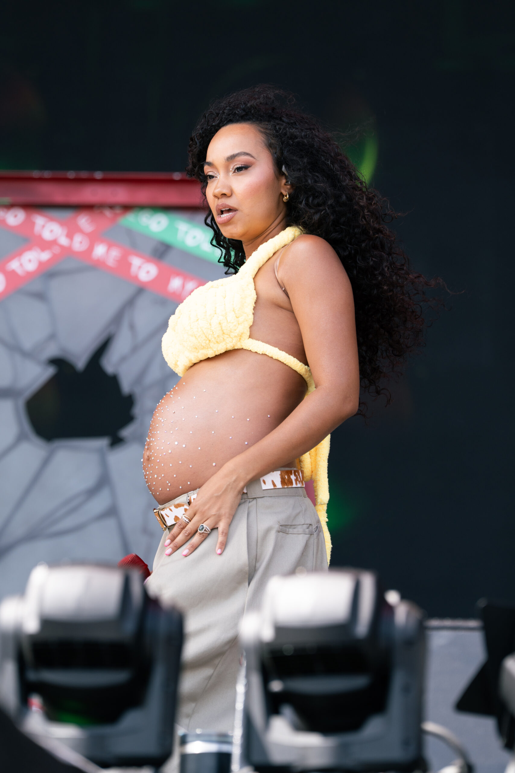 Pregnant Leigh-Anne Pinnock performing on stage