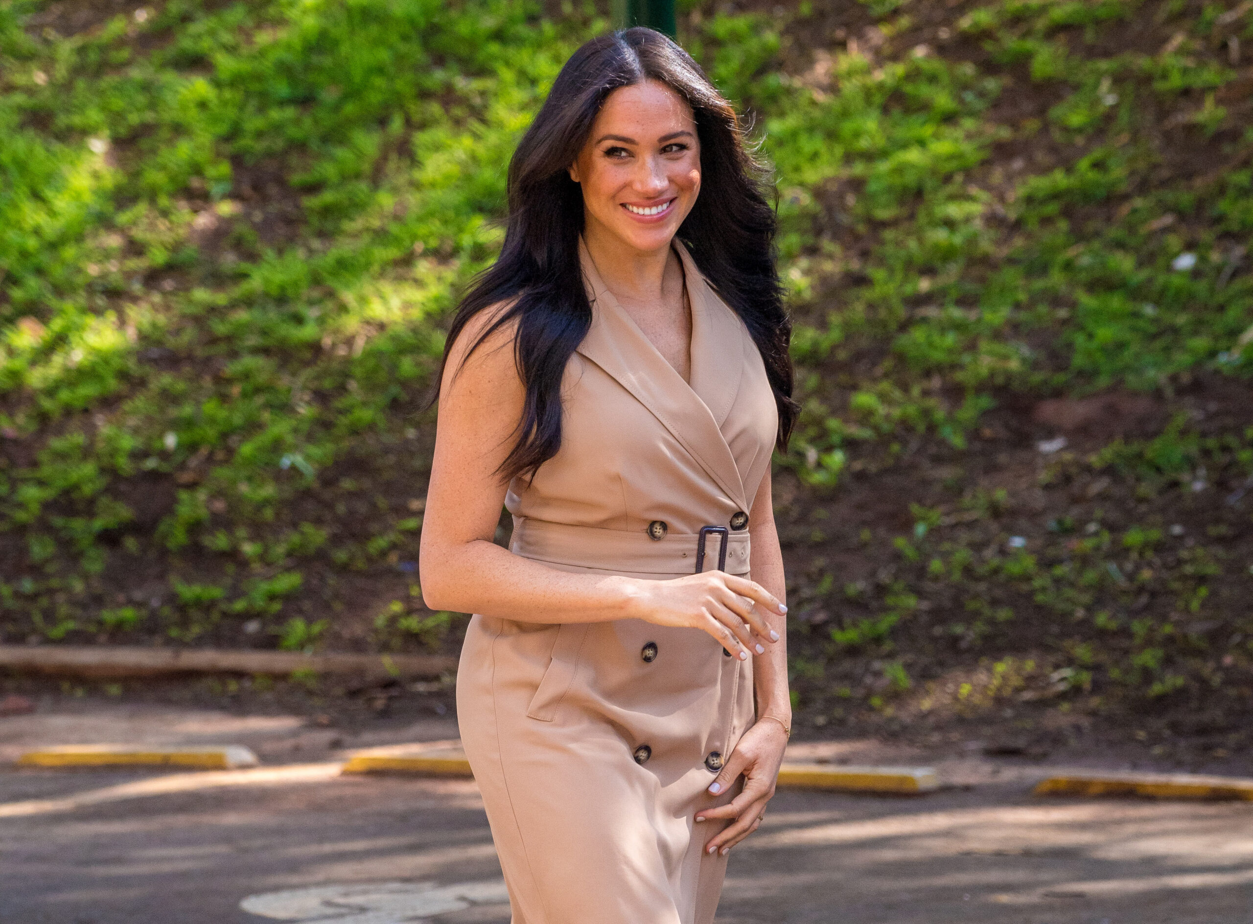 Meghan Markle smiling during royal engagement