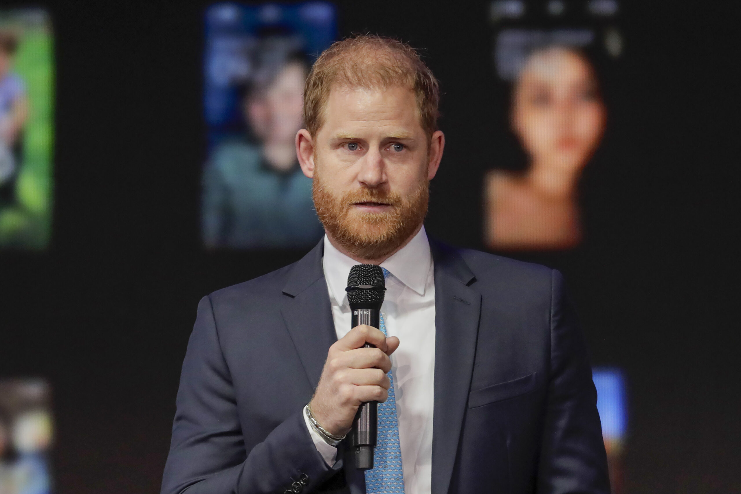 Prince Harry speaking into microphone