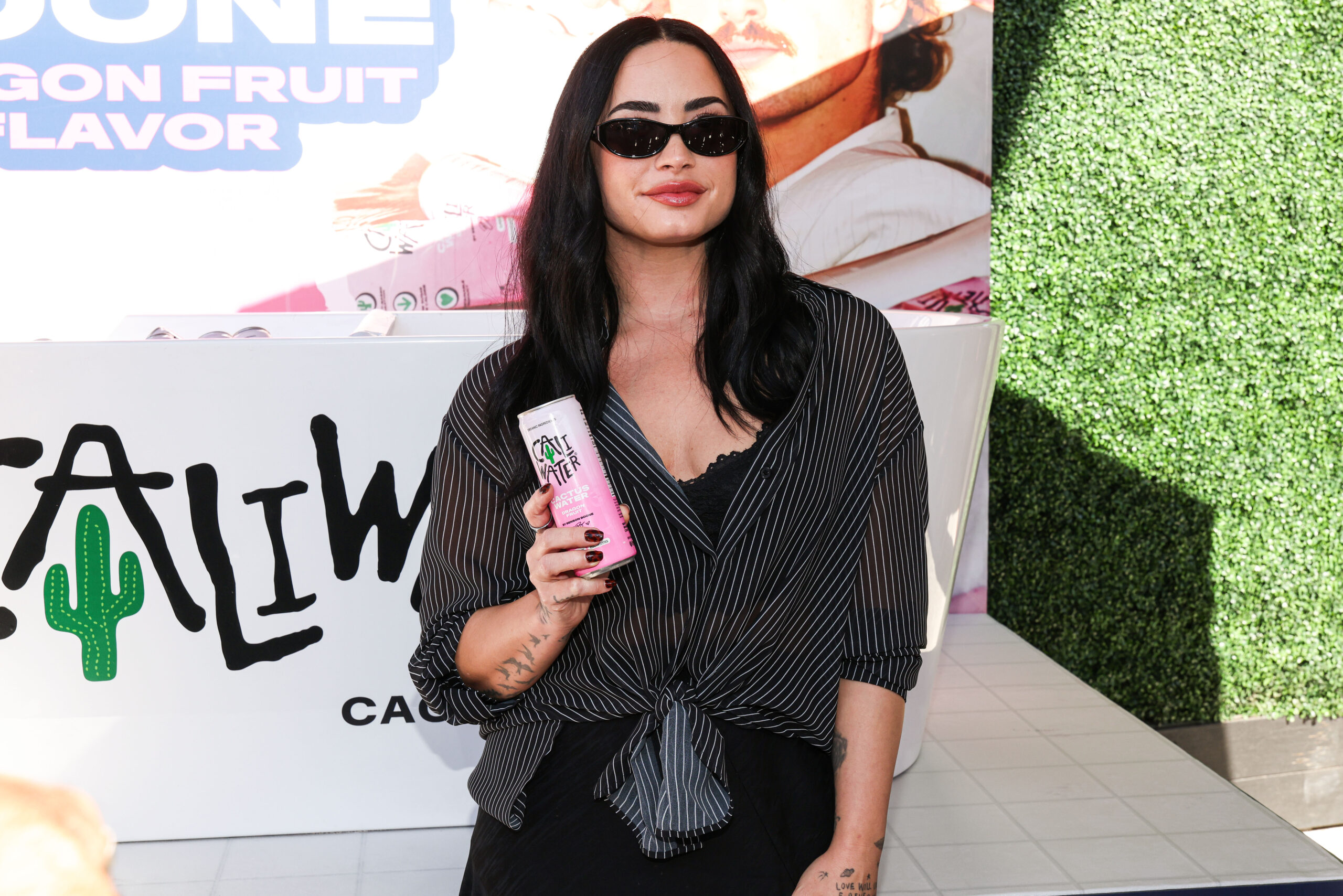 Demi Lovato carries her phone