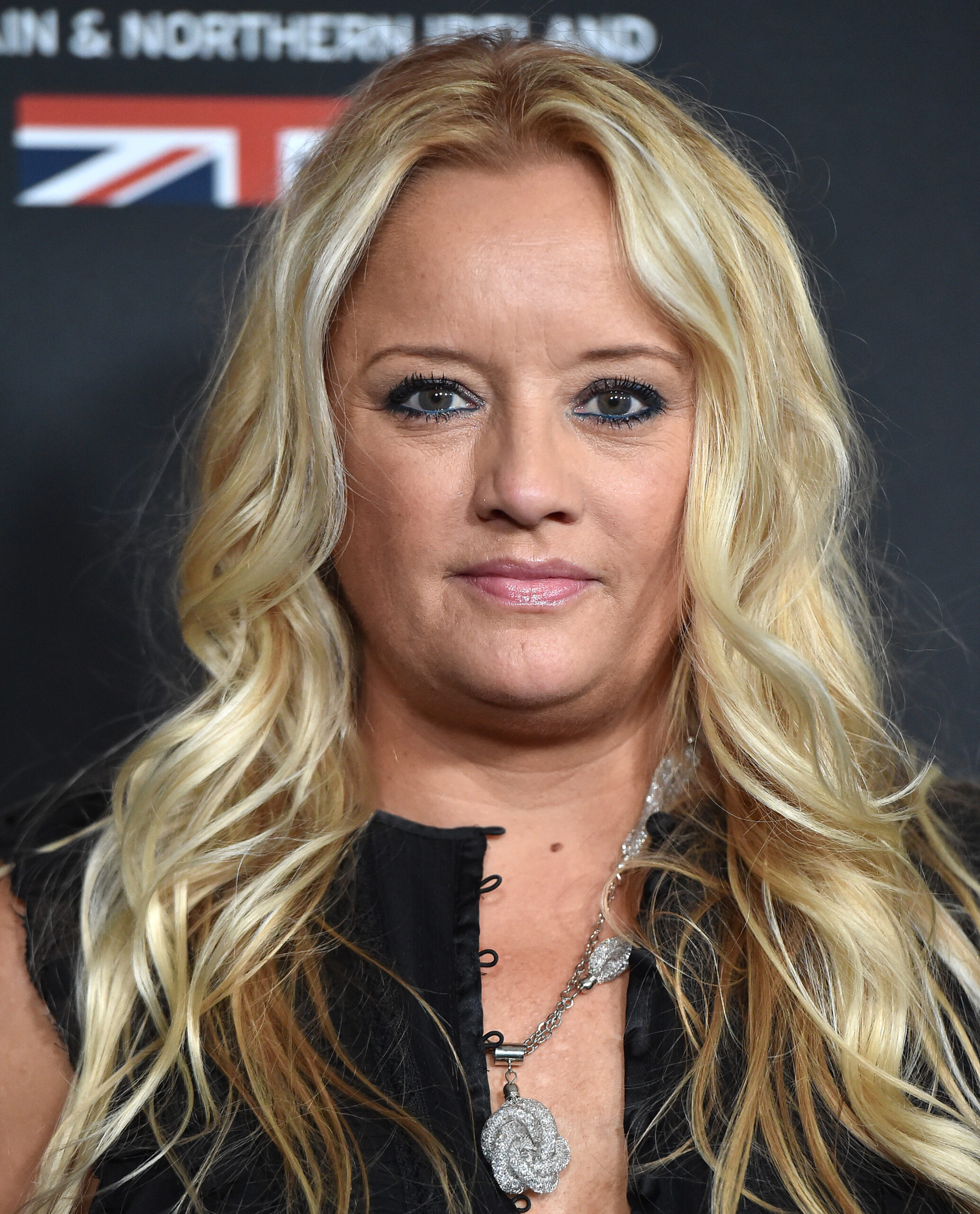 Lucy Davis wears her hair in crimped waves