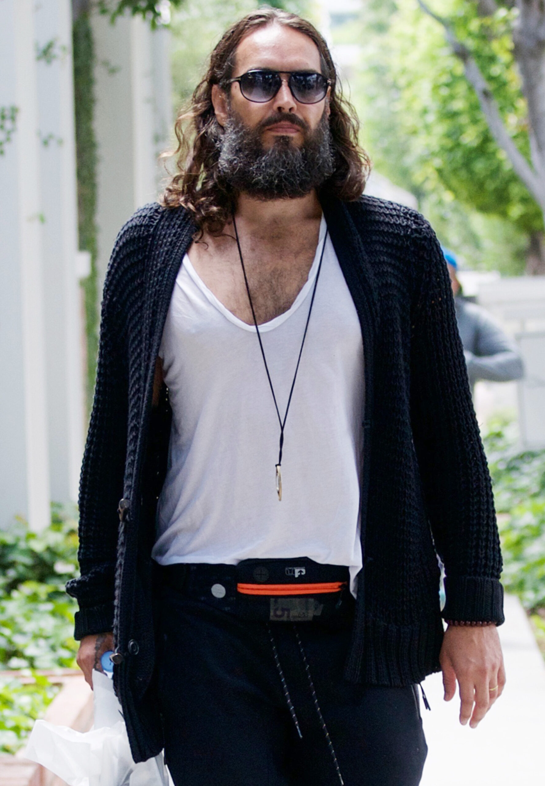 Russell Brand wearing sunglasses 