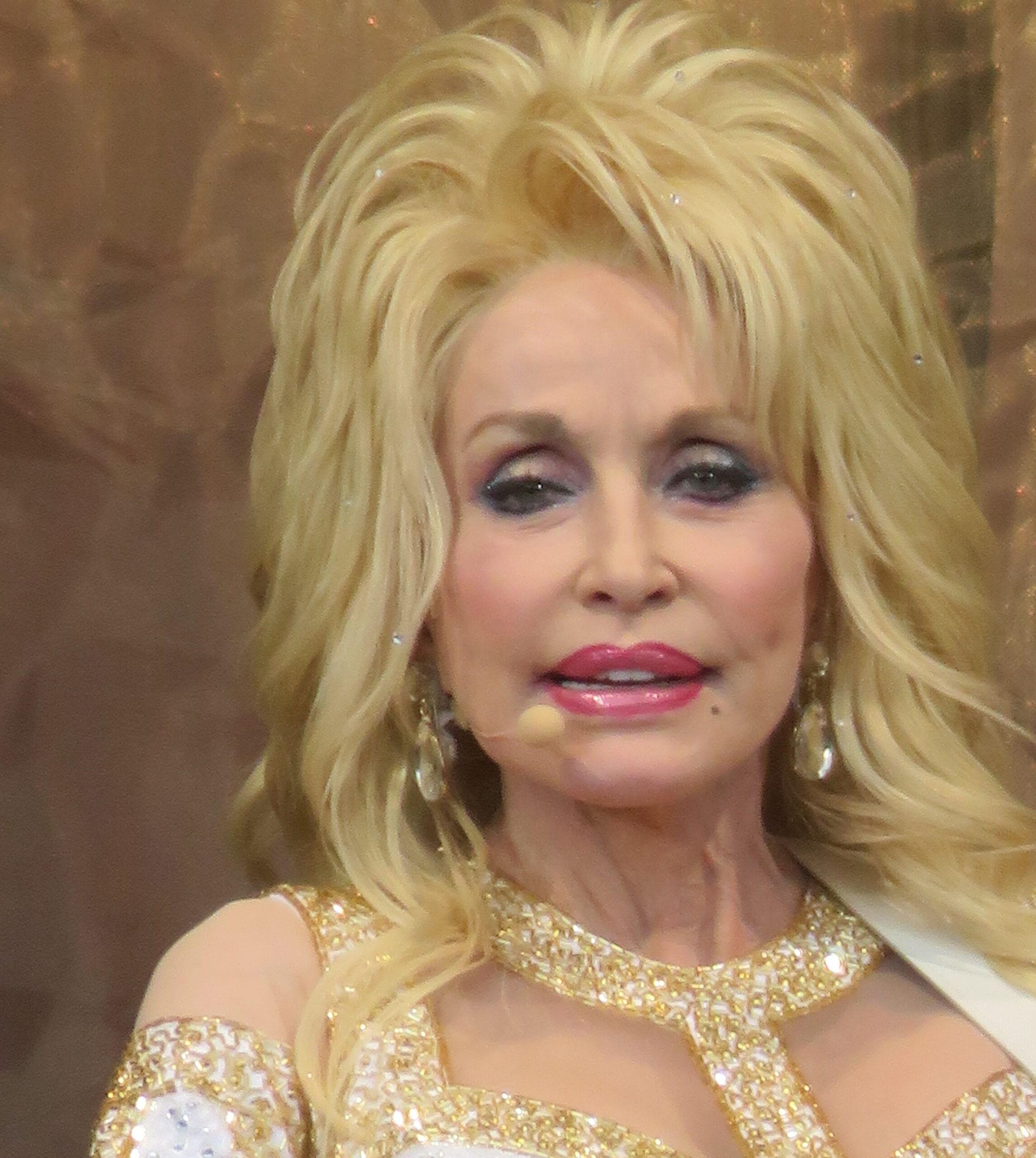 Dolly Parton wears bright red lipstick