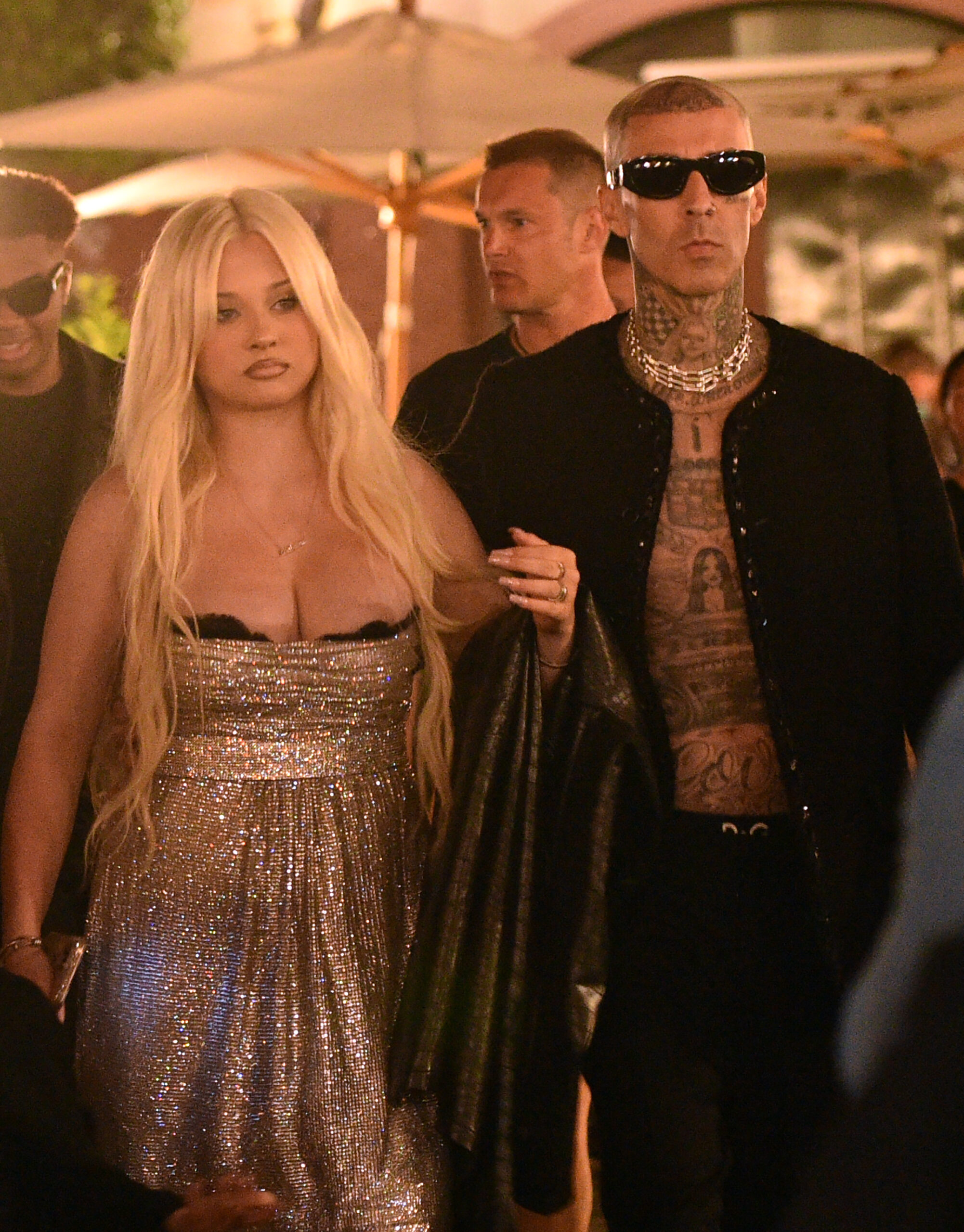 Alabama Barker and Travis walking side by side 