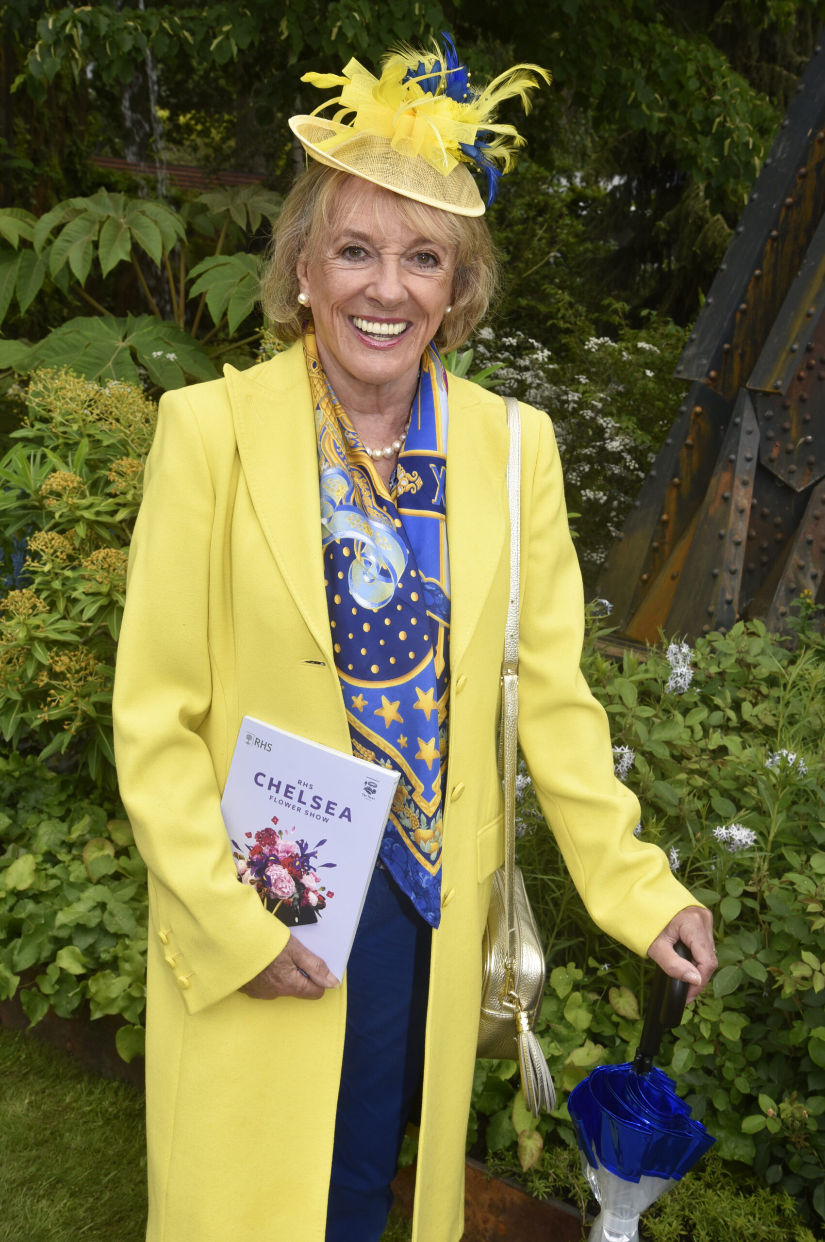 Dame Esther Rantzen in yellow outfit at Chelsea Flower Show