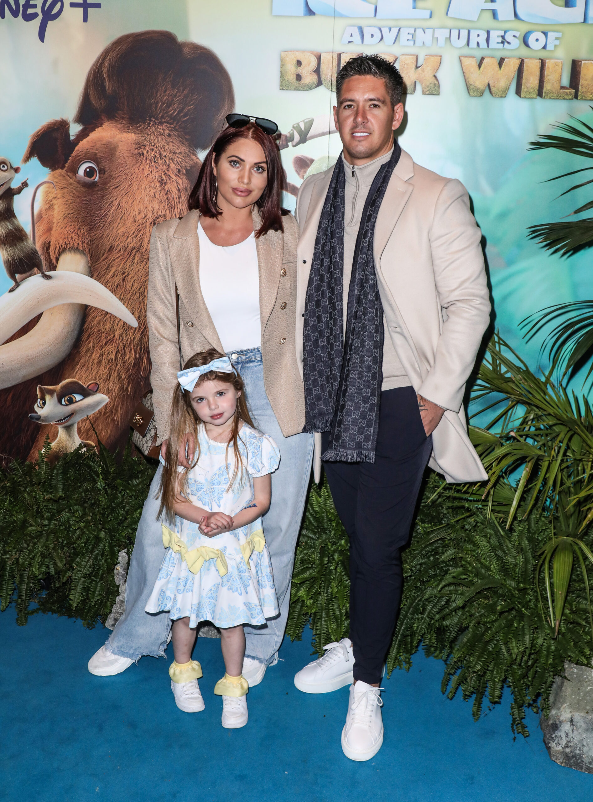 Amy Childs and Billy Delbosq with their daughter on the red carpet 
