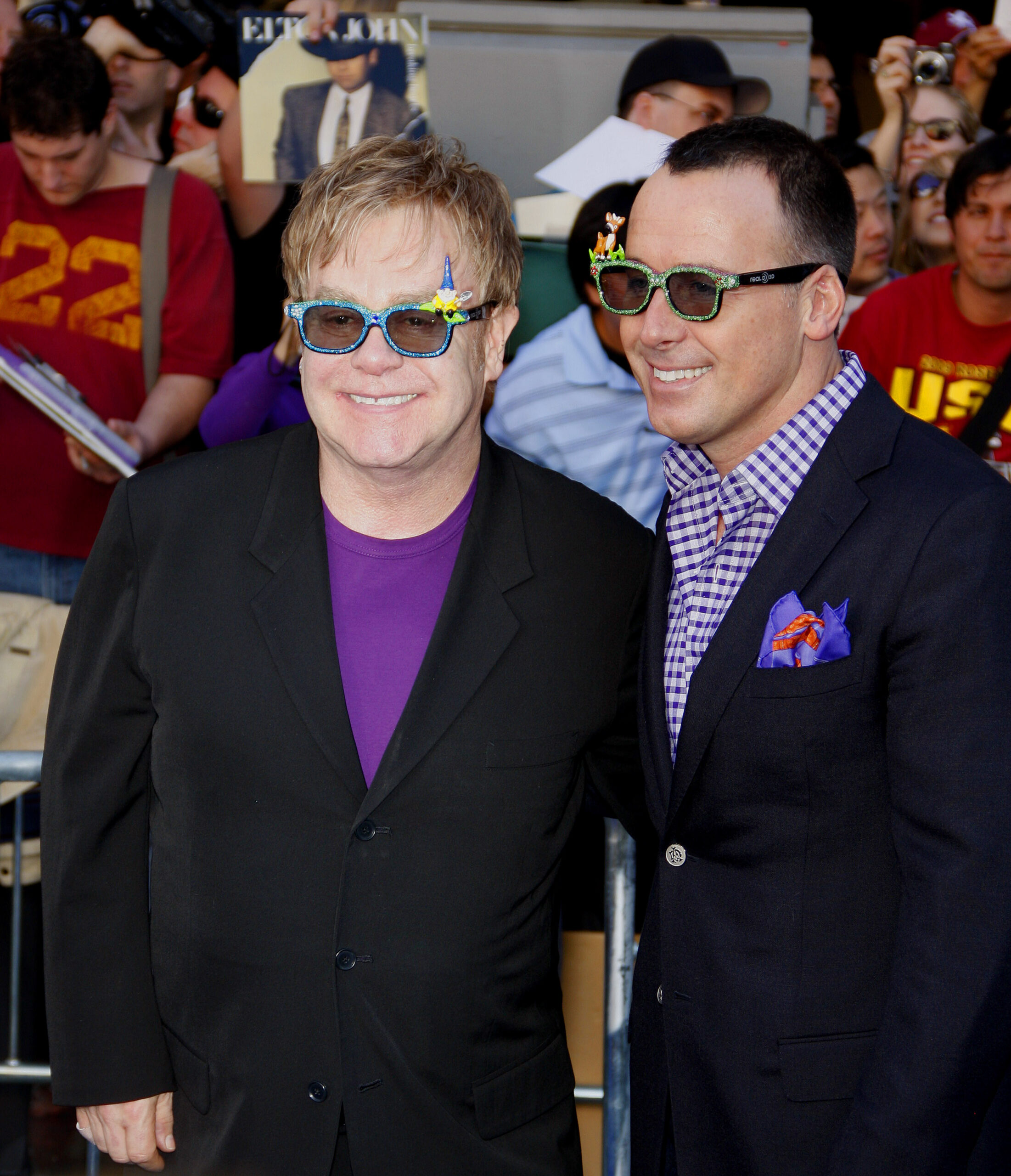 Elton John and David Furnish wear sunglasses