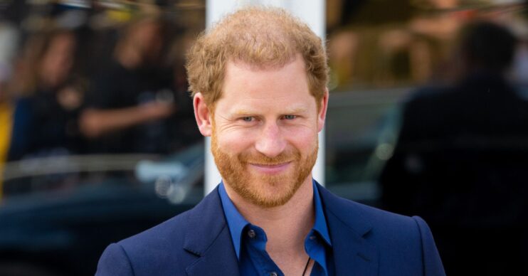 Prince Harry smiling at his first UK outing