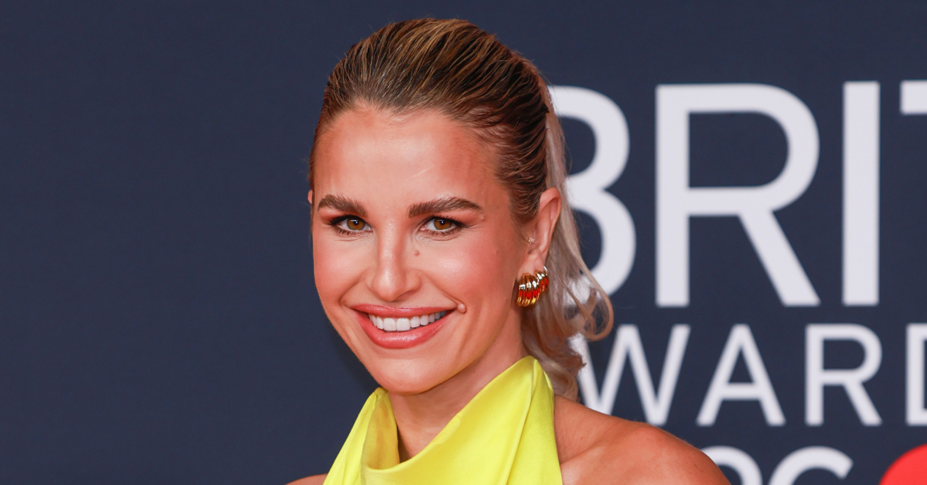 Vogue Williams smiling in green dress