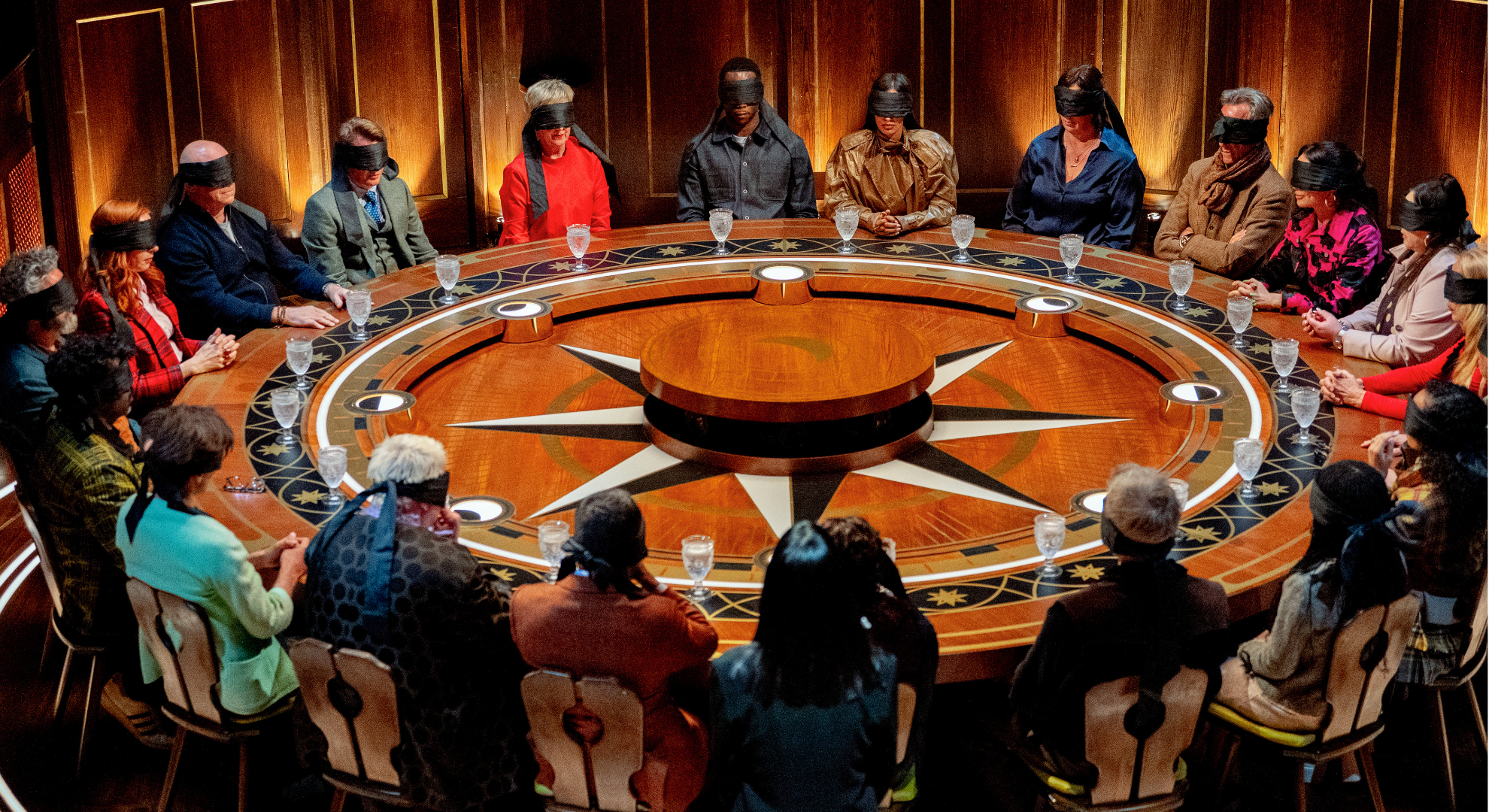 Cast of Celebrity Traitors around the roundtable