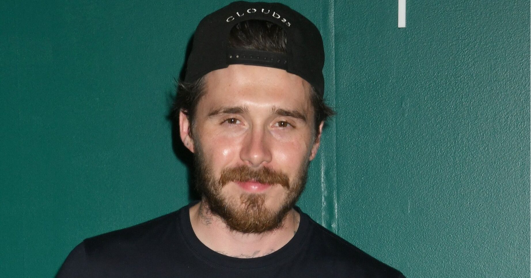 Brooklyn Beckham smiling