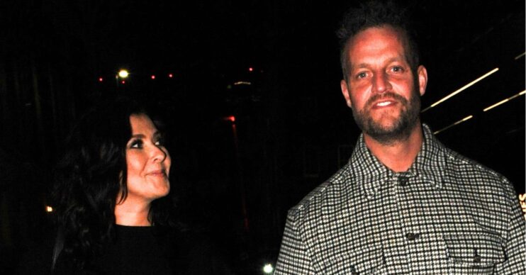 Kym Marsh looking at boyfriend Tom Dickinson