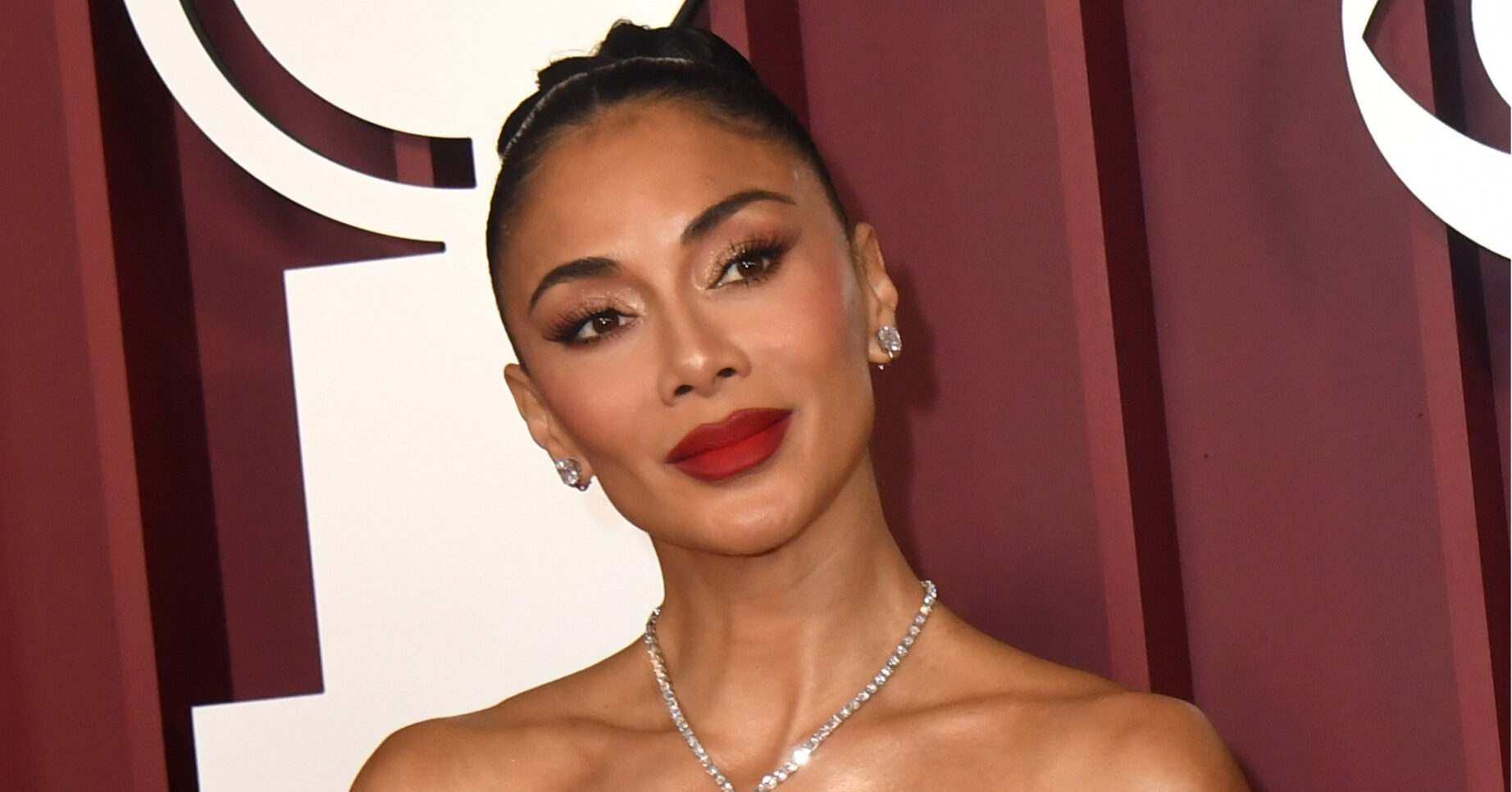 Nicole Scherzinger smiling at event