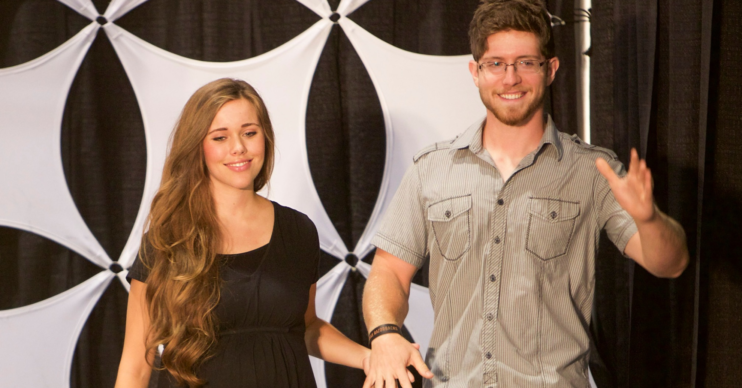 Jessa Duggar and her husband Ben Seewald hold hands