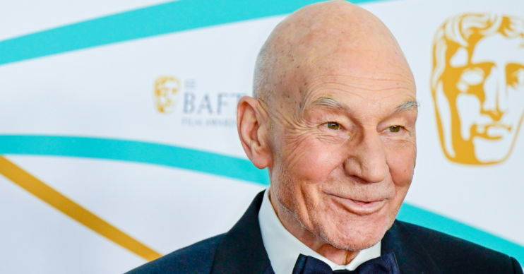 Patrick Stewart smiles on the red carpet