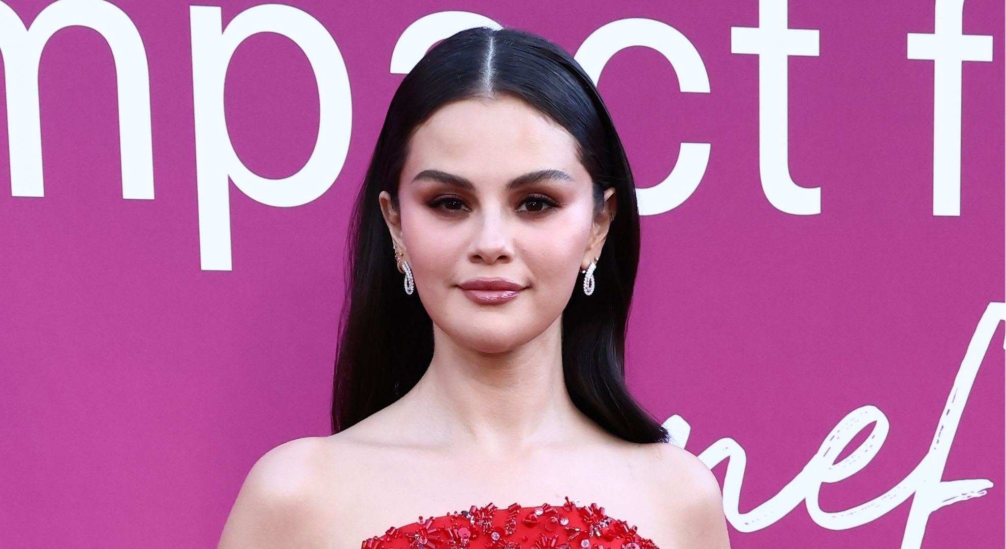 Selena Gomez stuns in statement red Prada dress as her Rare Impact Fund raises $30 million for youth mental health